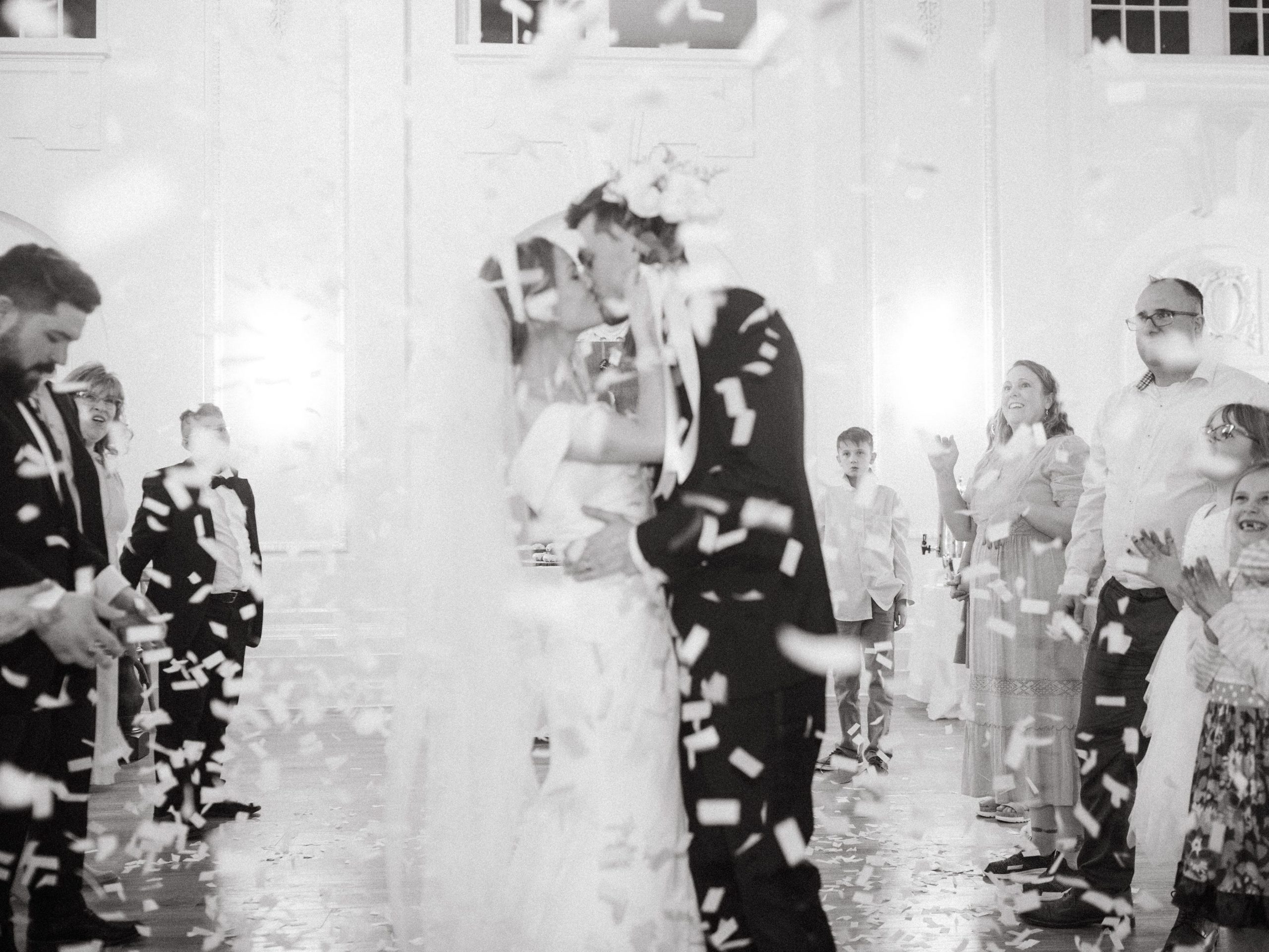 a bride and groom kissing at their wedding