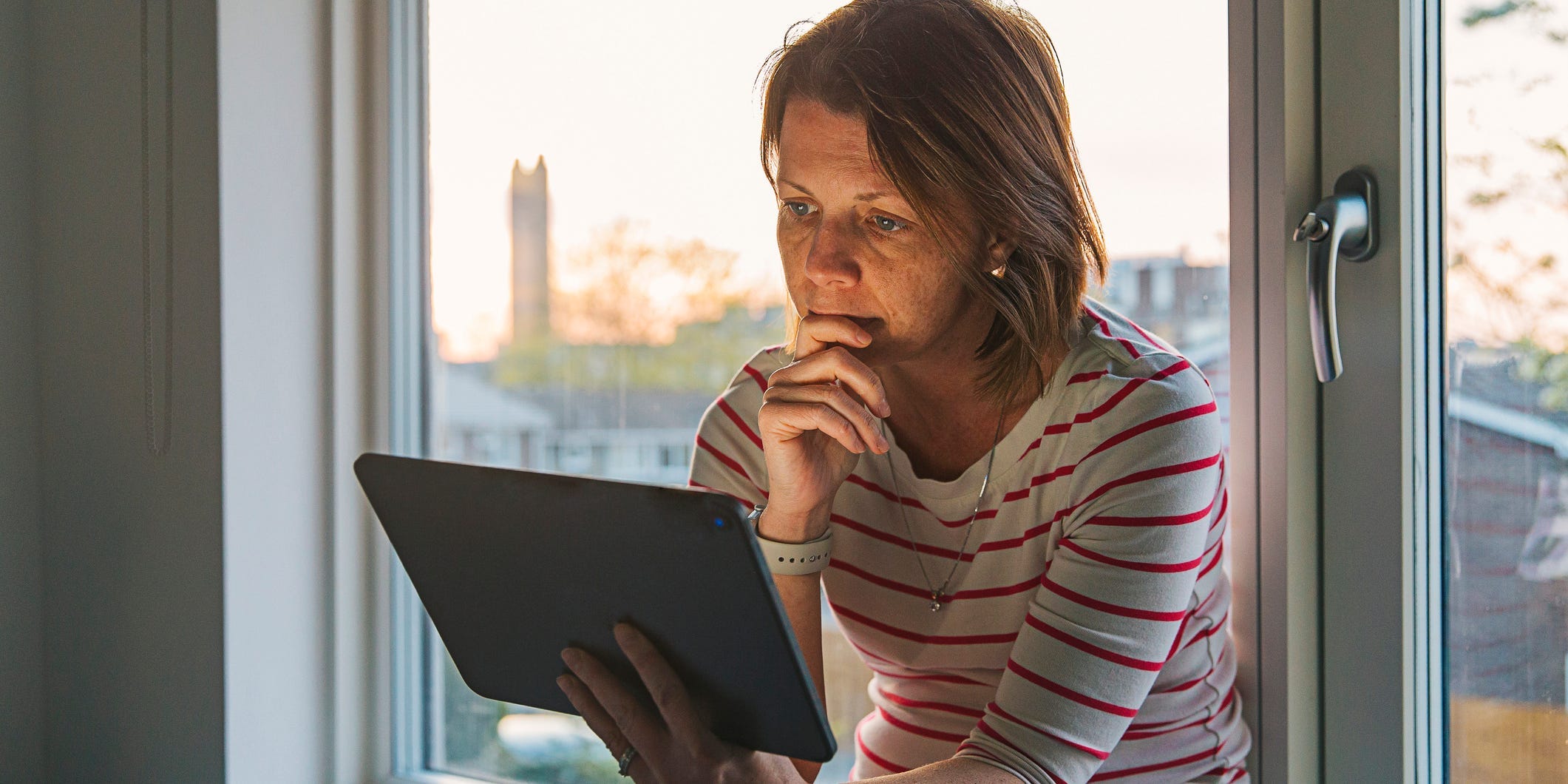 Woman looking at laptop