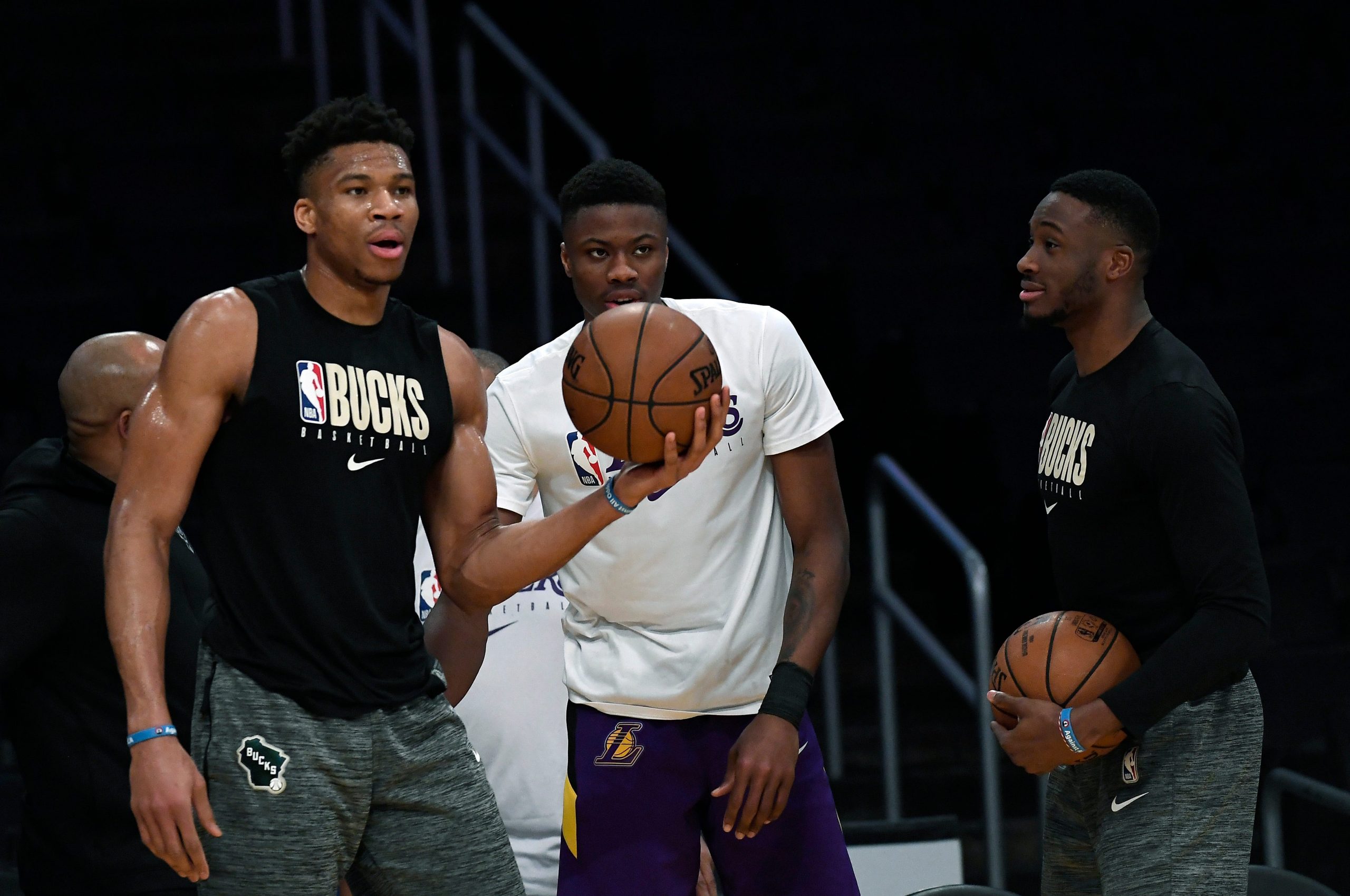 Giannis Antetokounmpo #34 of the Milwaukee Bucks gets together with and his brothers Kostas Antetokounmpo #37 of the Los Angeles Lakers and Thanasis Antetokounmpo #43 of the Milwaukee Bucks