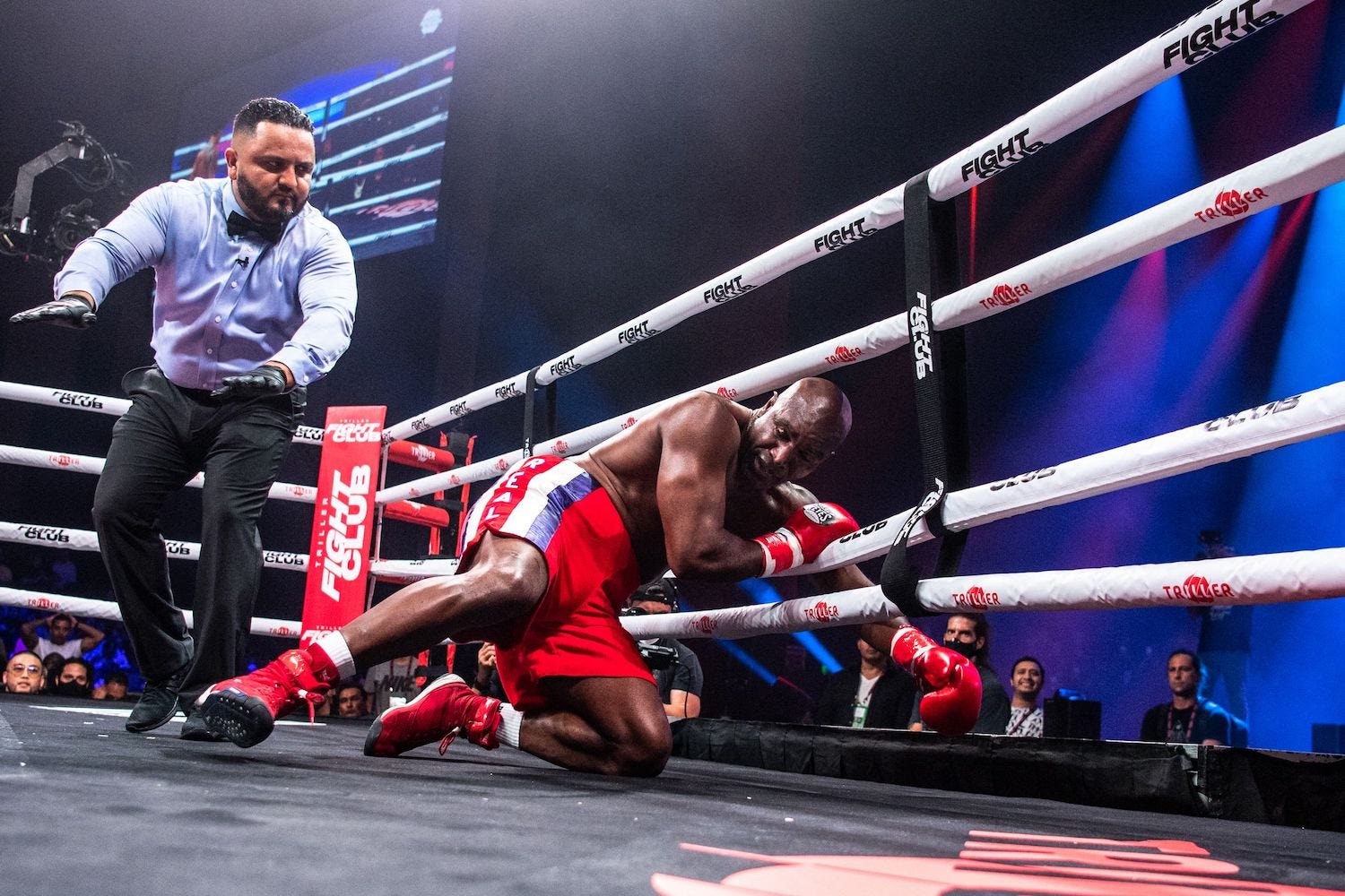 Evander Holyfield fell to the floor early in his crossover bout against Vitor Belfort.