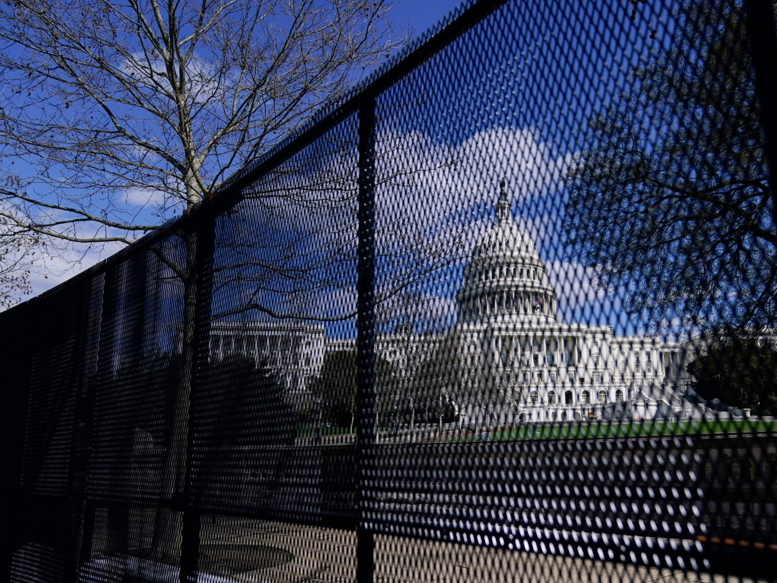 In this April 2, 2021, file photo, the U.S. Capitol is seen behind security fencing on Capitol Hill in Washington.