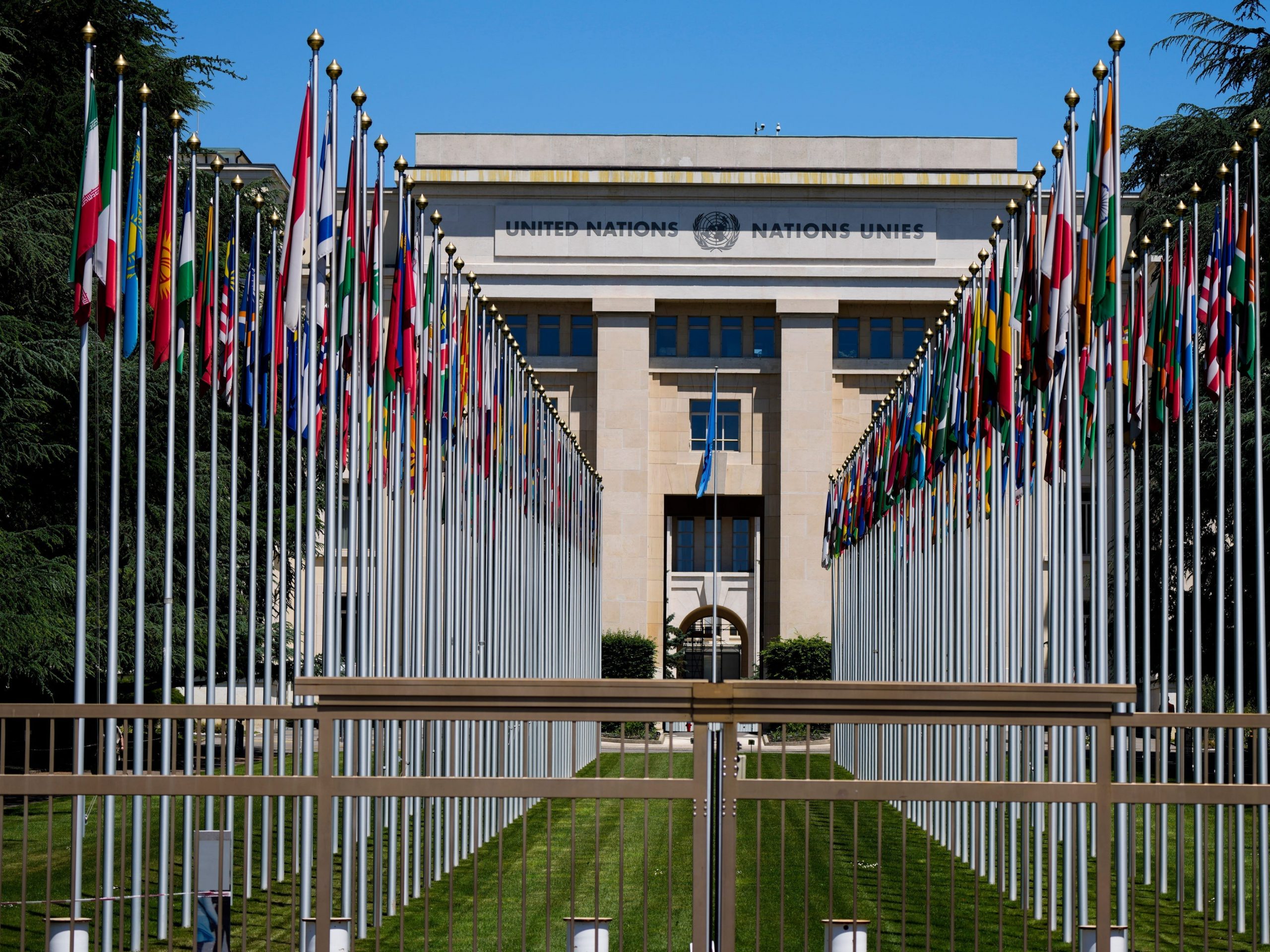 Flagpoles line in rows in front of a building of the United Nations in Geneva, Switzerland Monday, June 14, 2021.