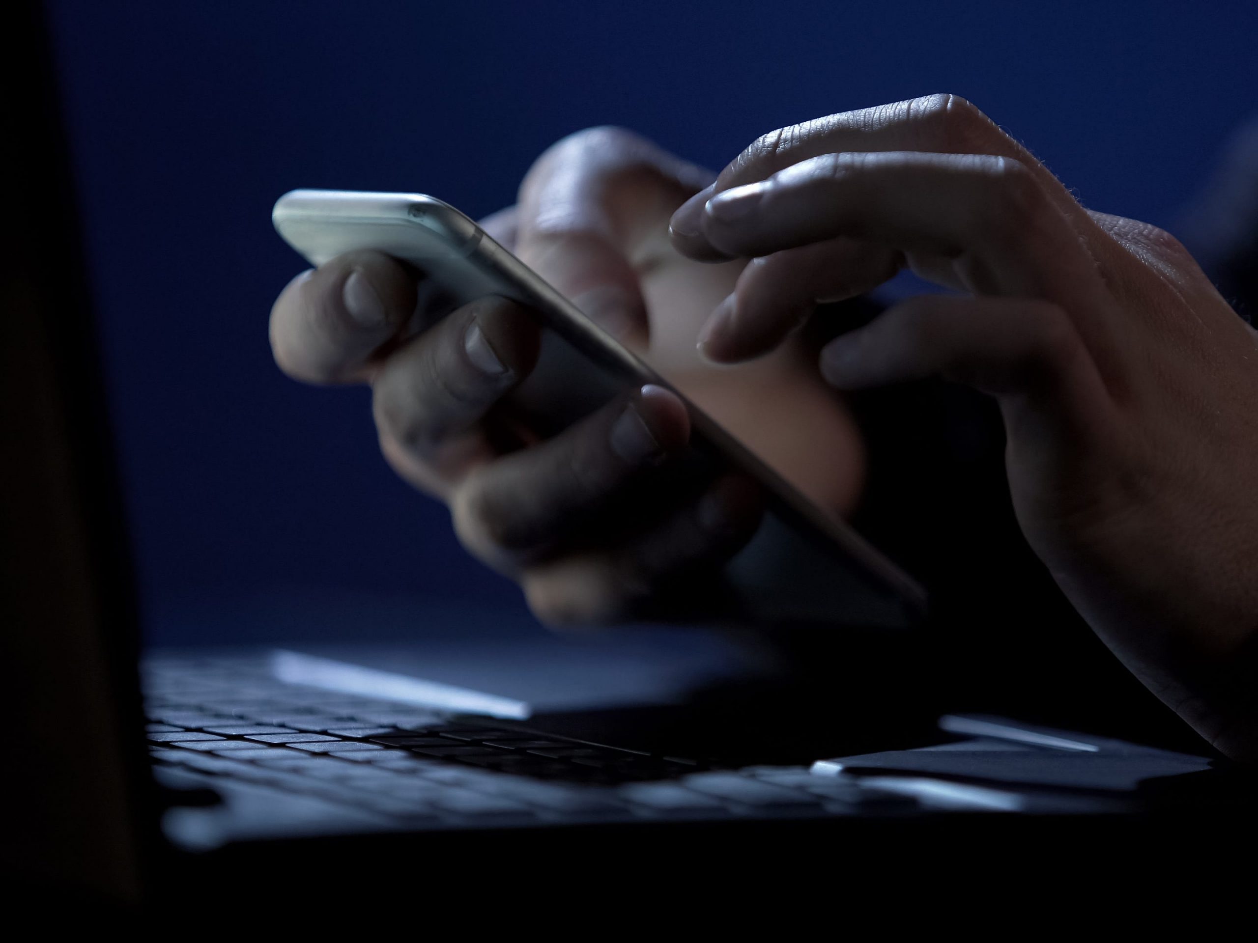 scammer hacker computer on phone