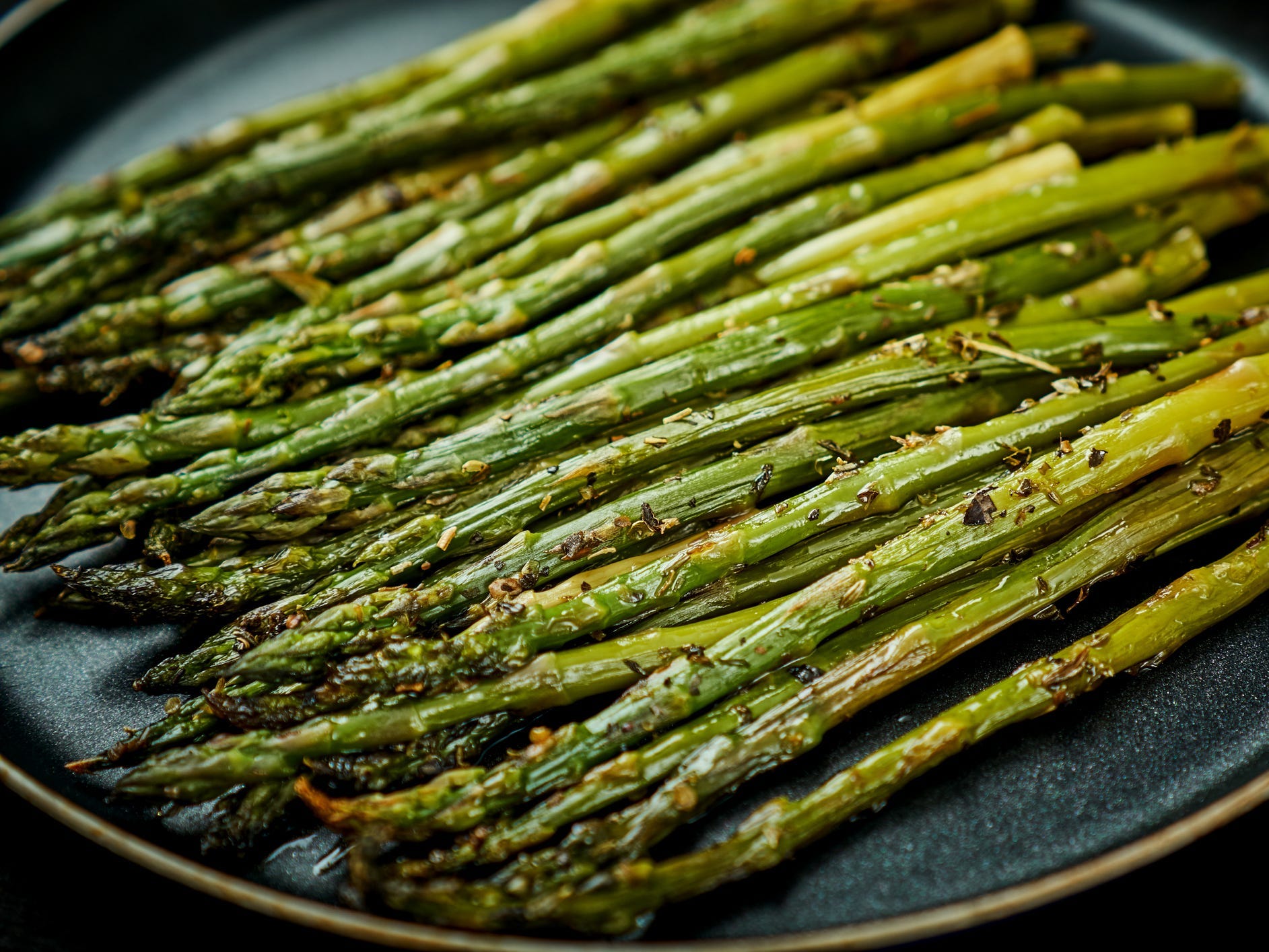 A large plate of roasted asparagus