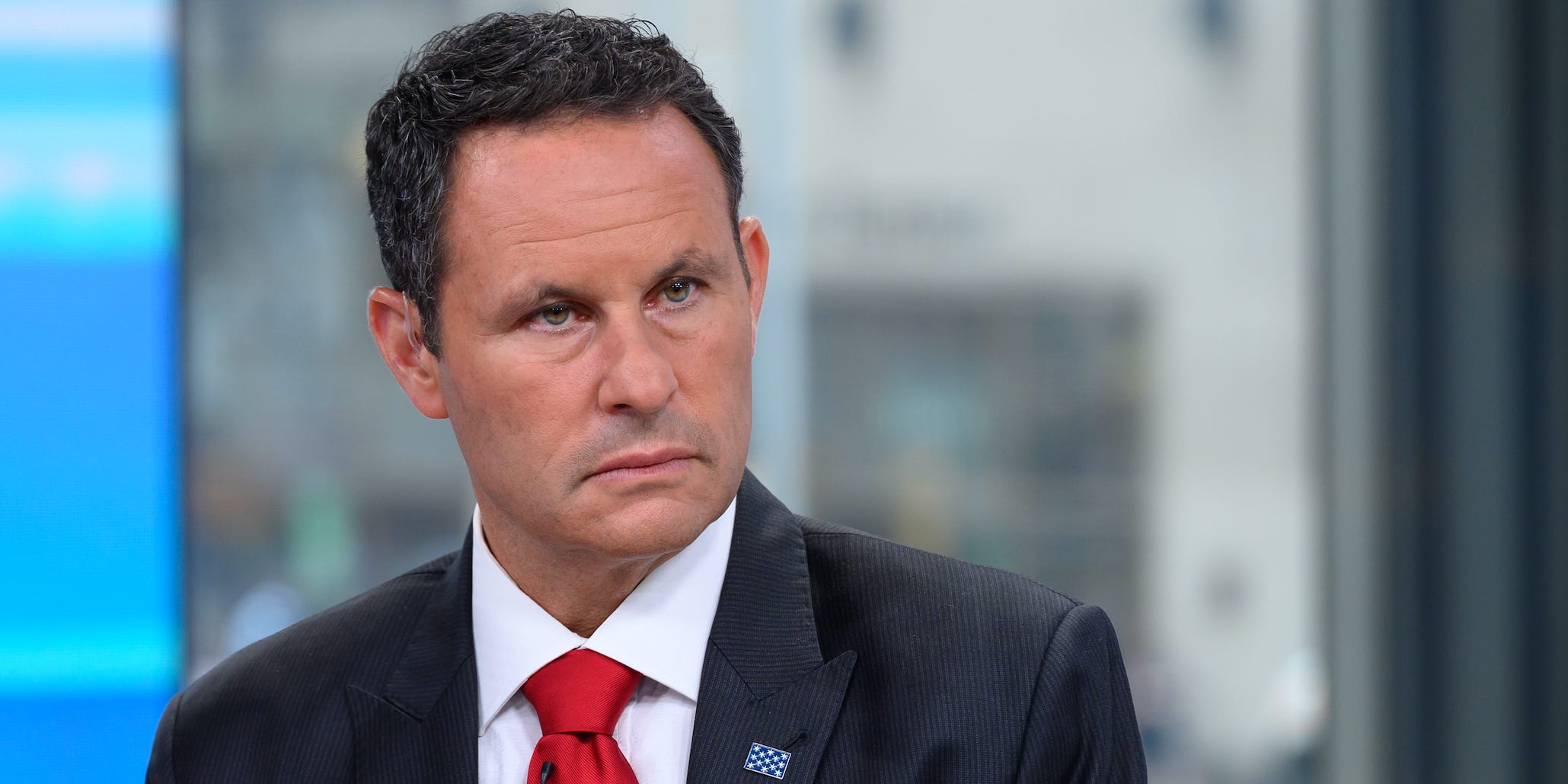 Brian Kilmeade of Fox News stares off camera.