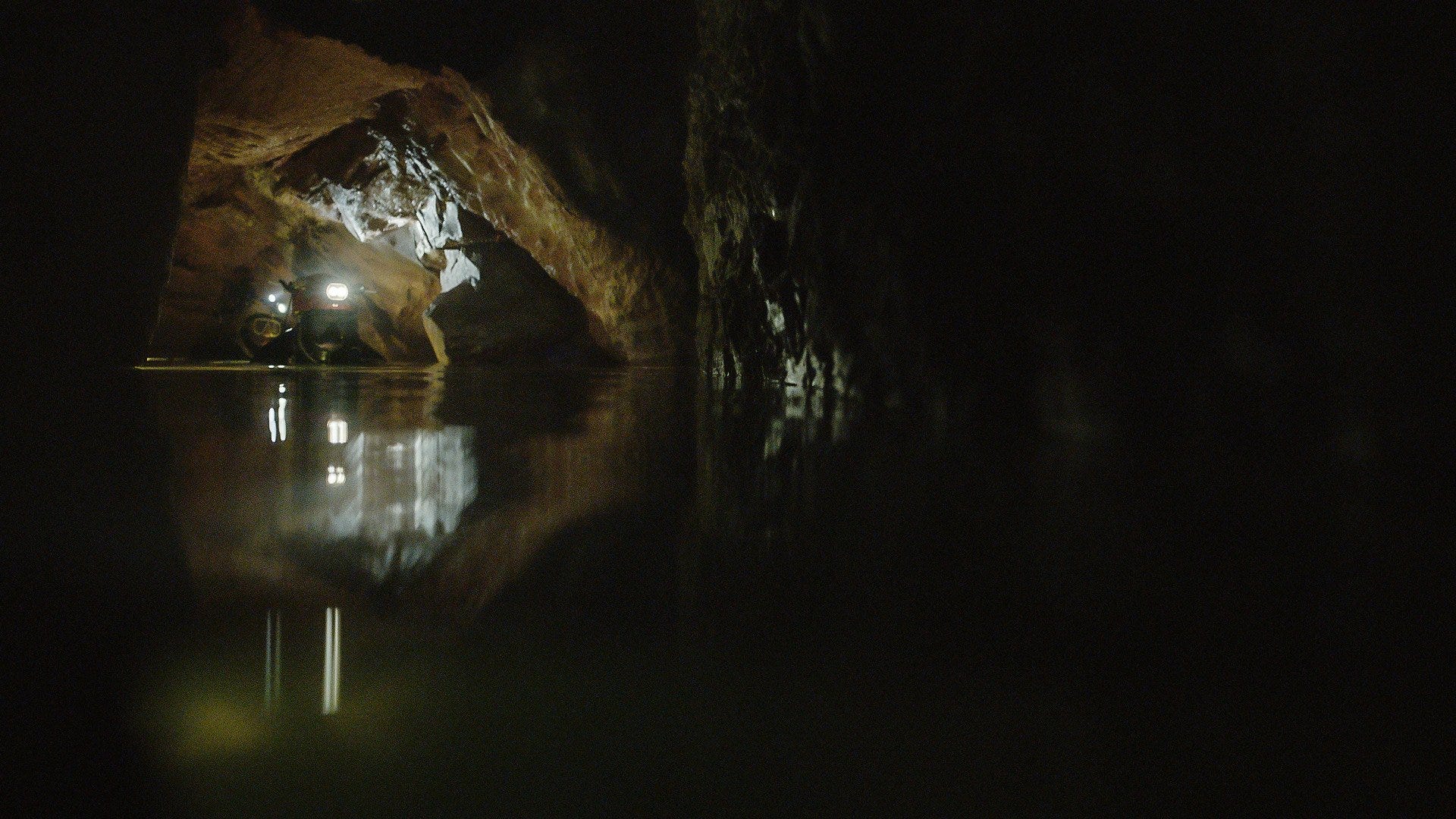 Cave divers in the water