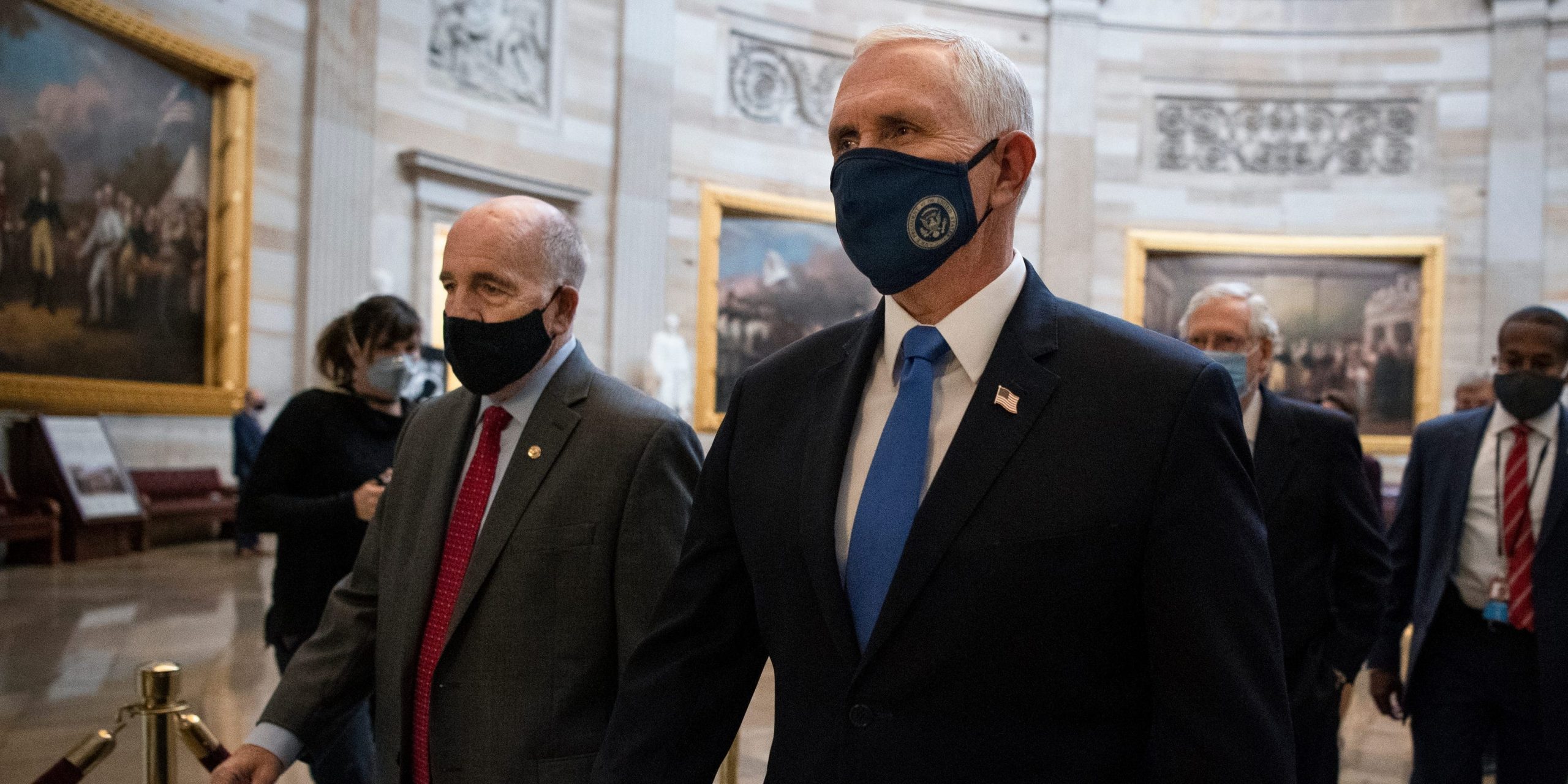 Vice President Mike Pence makes his way to the House floor to tally electoral college votes on Jan. 6, 2021.