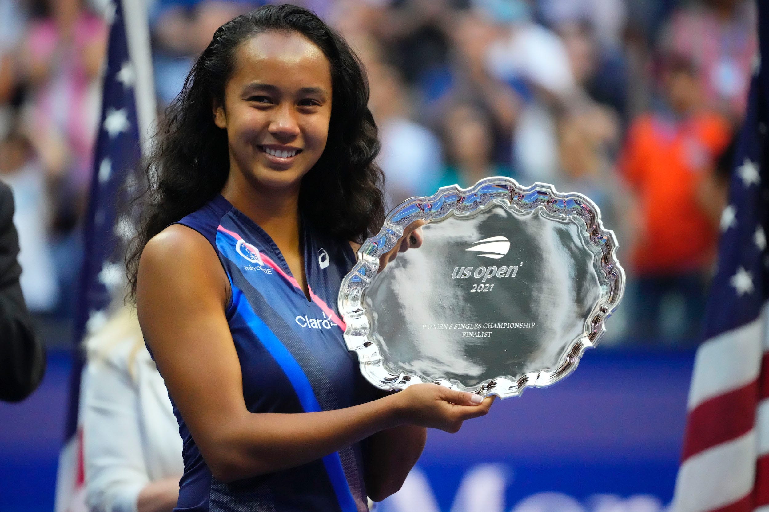 Leylah Fernandez poses with her US Open runner-up trophy.