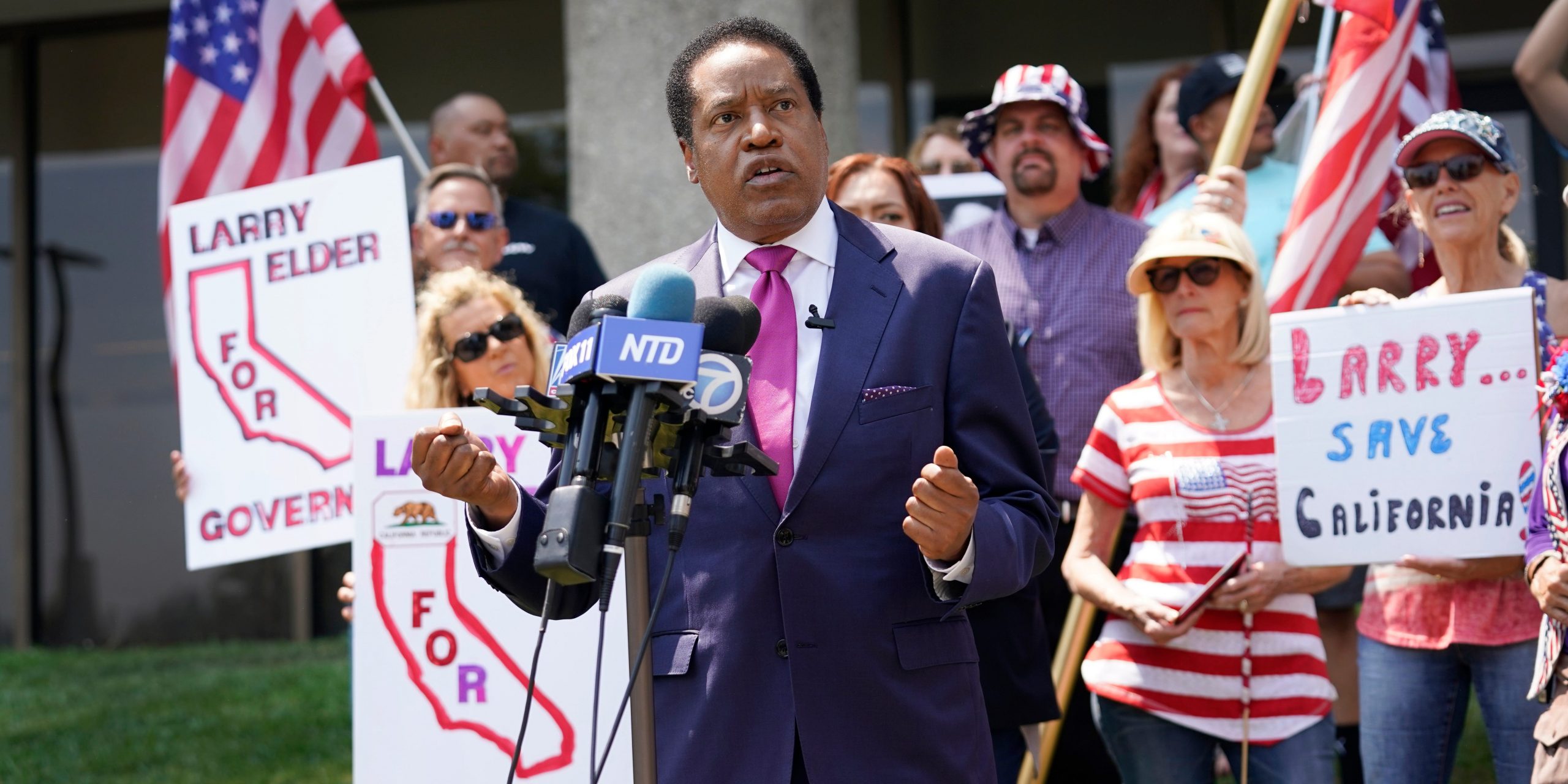 In this July 13, 2021 file photo radio talk show host Larry Elder speaks to supporters during a campaign stop in Norwalk, Calif.