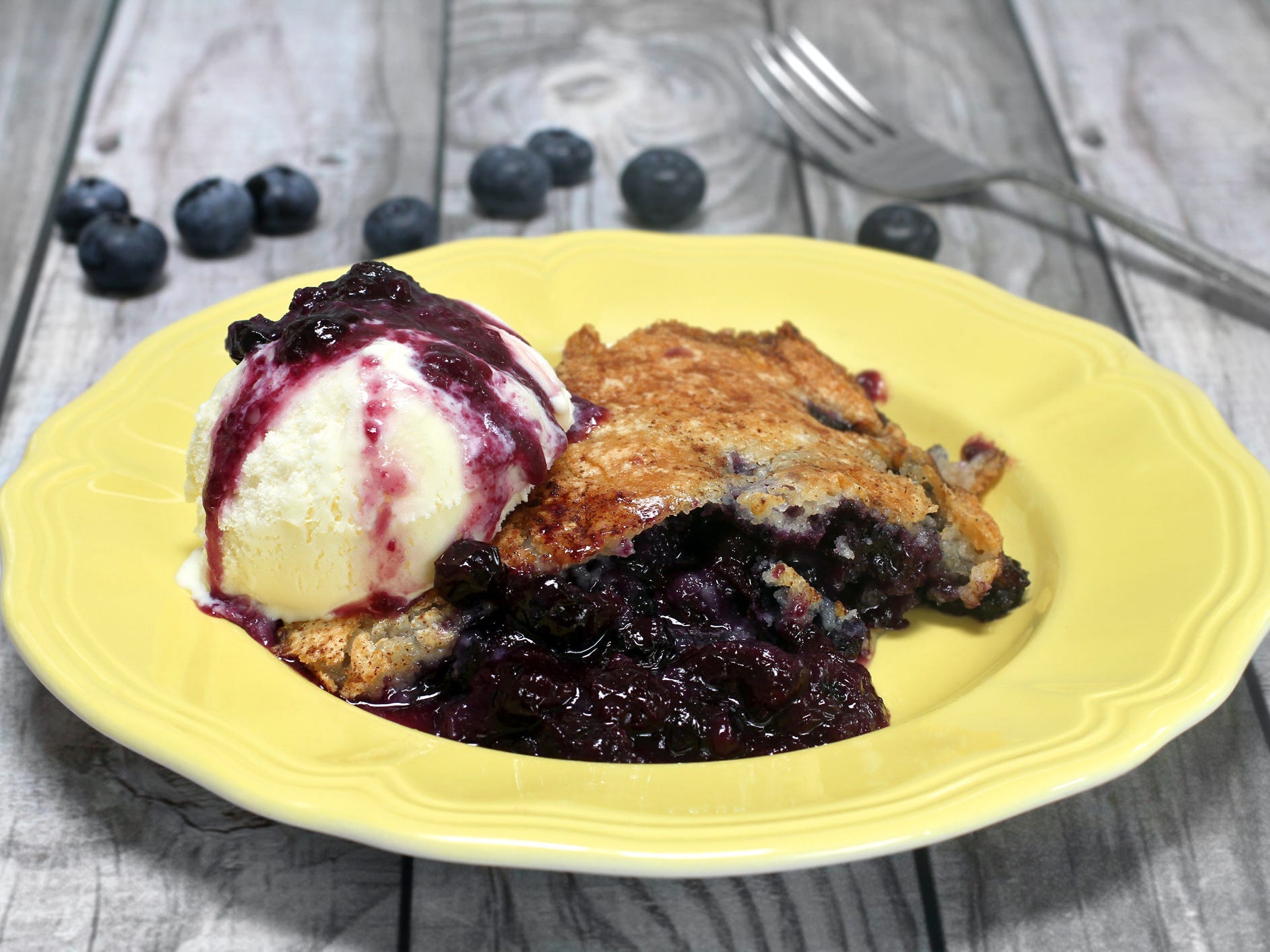 Blueberry cobbler with ice cream.