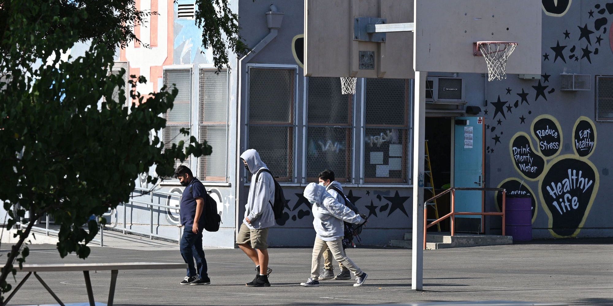 Students walk to their classrooms at a public middle school in Los Angeles, California, September 10, 2021.