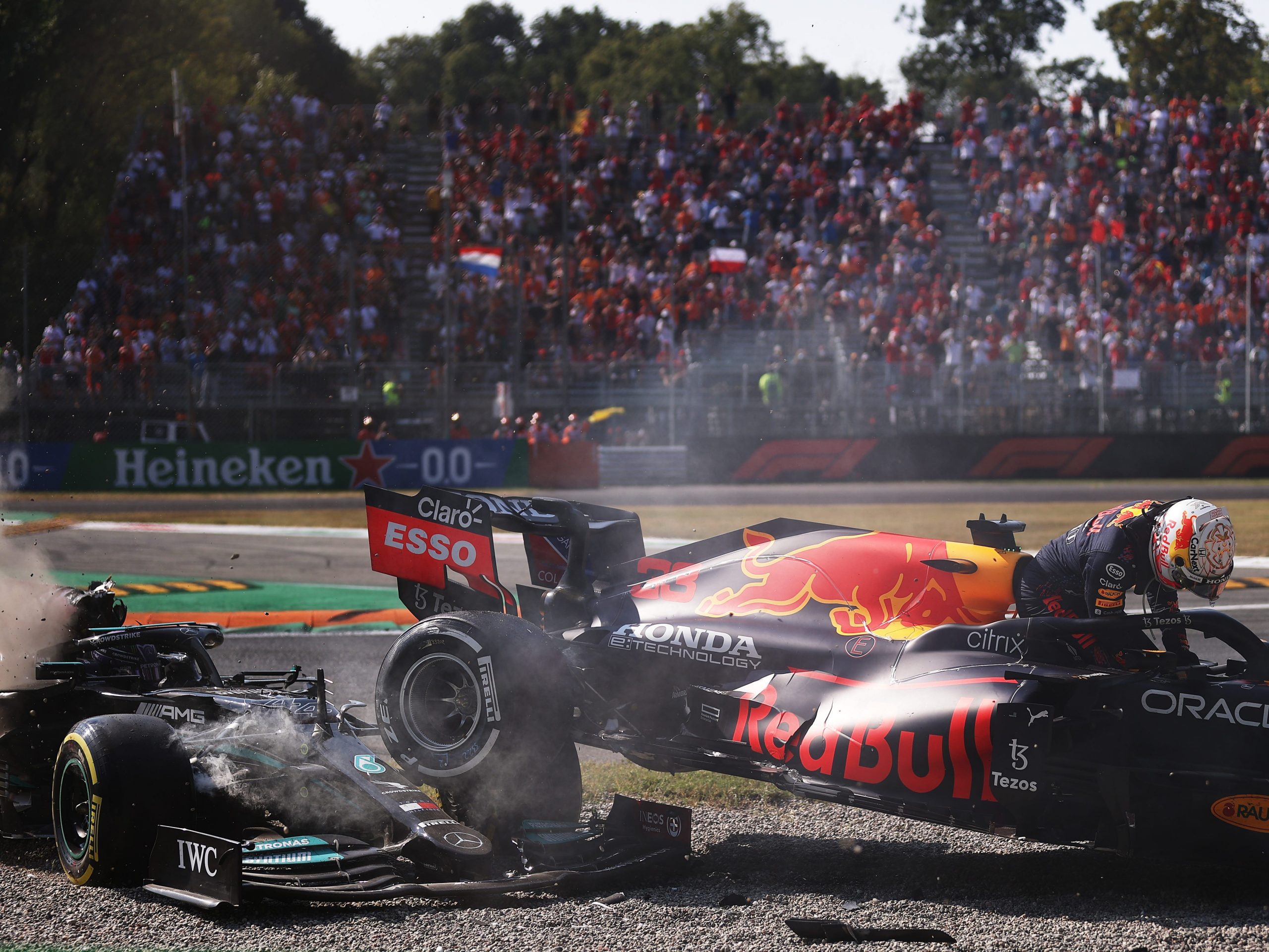 The cars of Max Verstappen and Lewis Hamilton beached after a crash