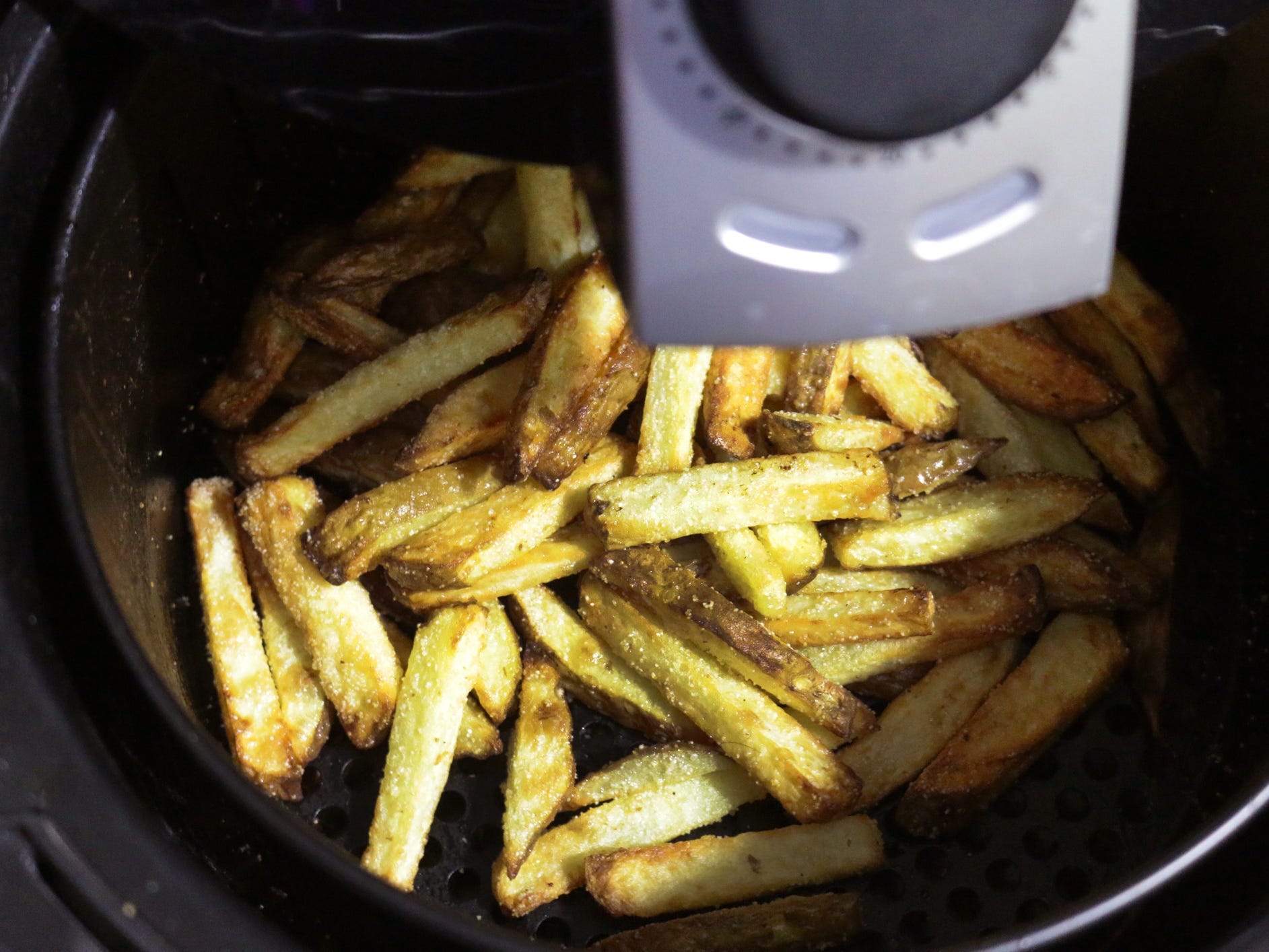 French fries in an air fryer.