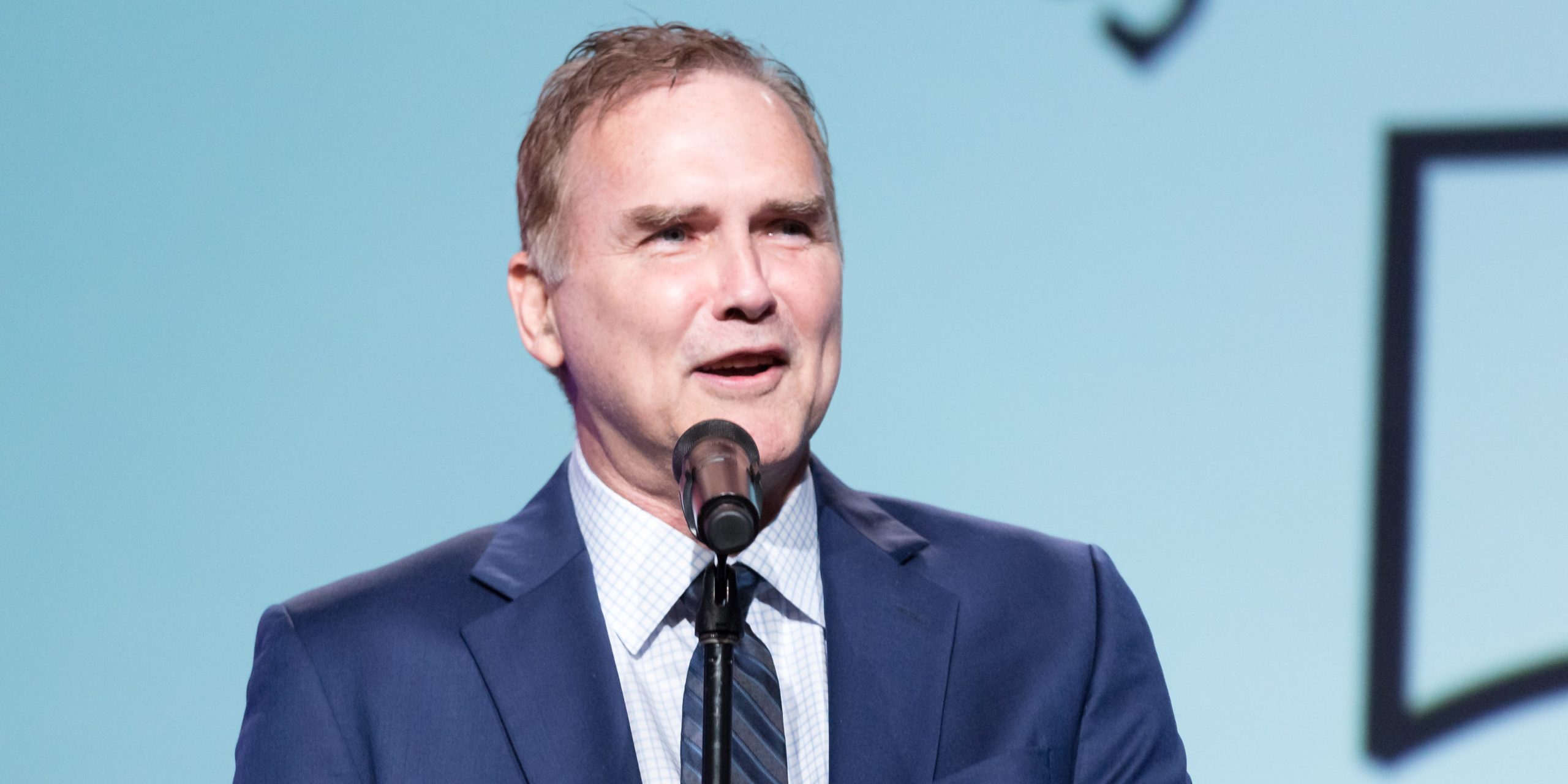 Comedian Norm MacDonald performs on stage at the Saban Community Clinic's 50th Anniversary Dinner Gala at The Beverly Hilton Hotel on November 13, 2017 in Beverly Hills, California.