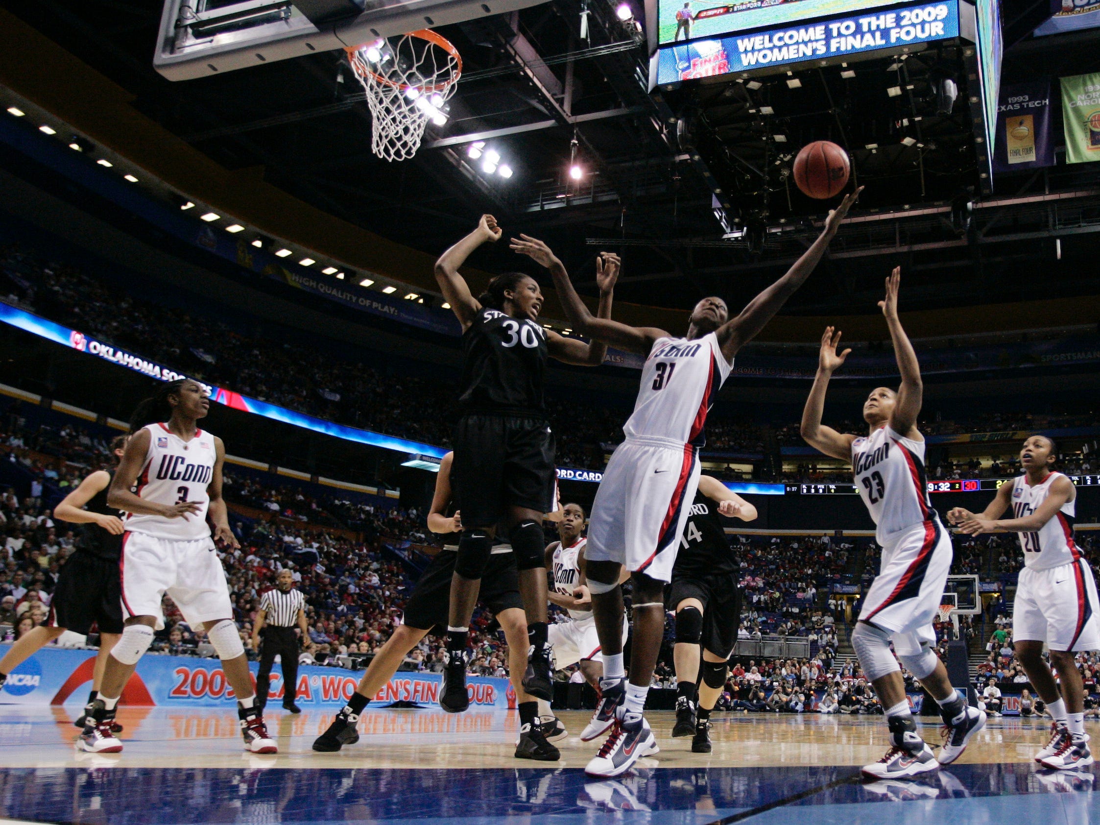 Tina Charles grabs a rebound for the UConn Huskies.