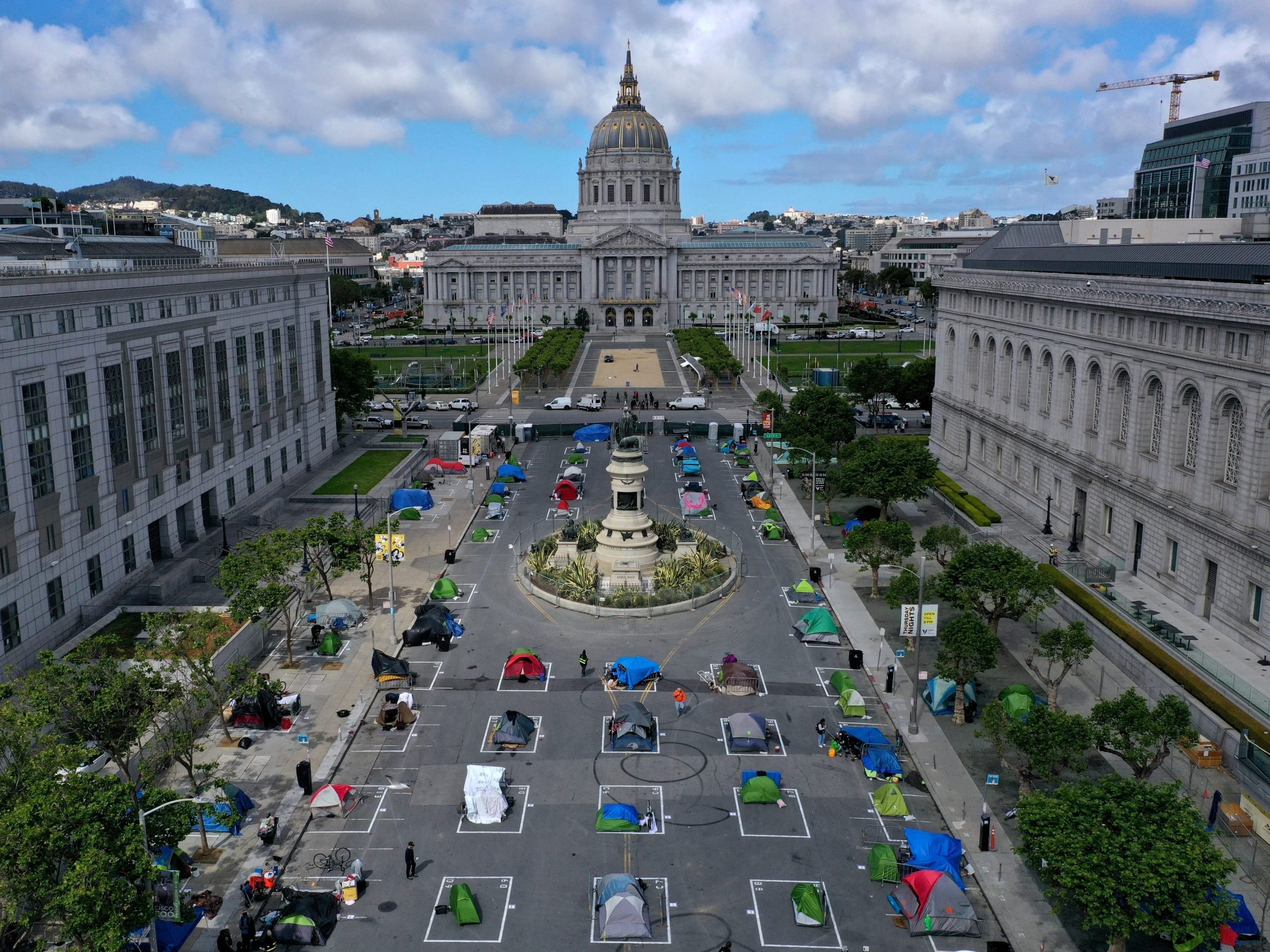 An aerial view of San Francisco's first temporary sanctioned tent encampment for the homeless on May 18, 2020 in San Francisco, California. After public outrage mounted over a surge of homeless people and tents filling the streets of San Francisco during the coronavirus (COVID-19) pandemic, the City opened its first temporary sanctioned tent encampment.