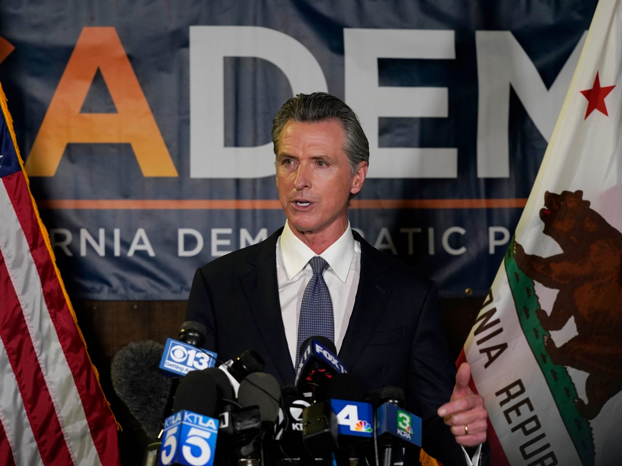 California Gov. Gavin Newsom addresses reporters after beating back the recall attempt that aimed to remove him from office, at the John L. Burton California Democratic Party headquarters in Sacramento, Calif., Tuesday, Sept. 14, 2021.