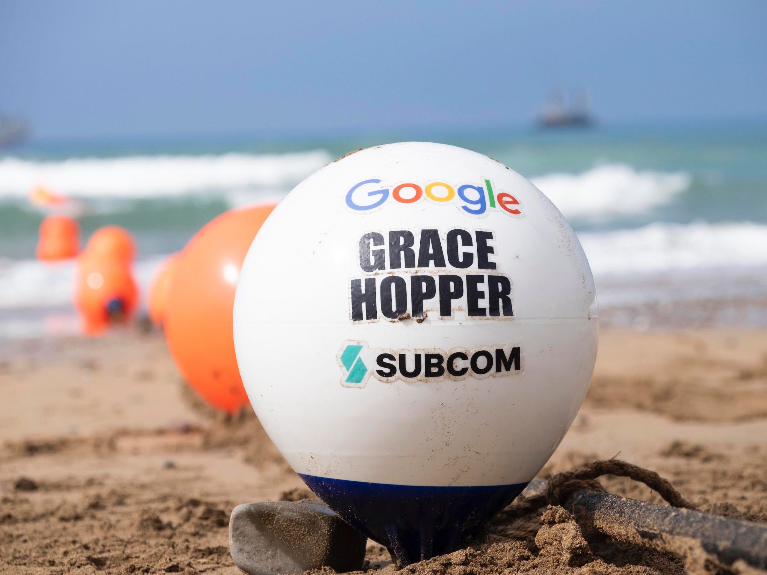 A buoy at the end of the Grace Hopper subsea cable sits on the beach in Bude, UK.