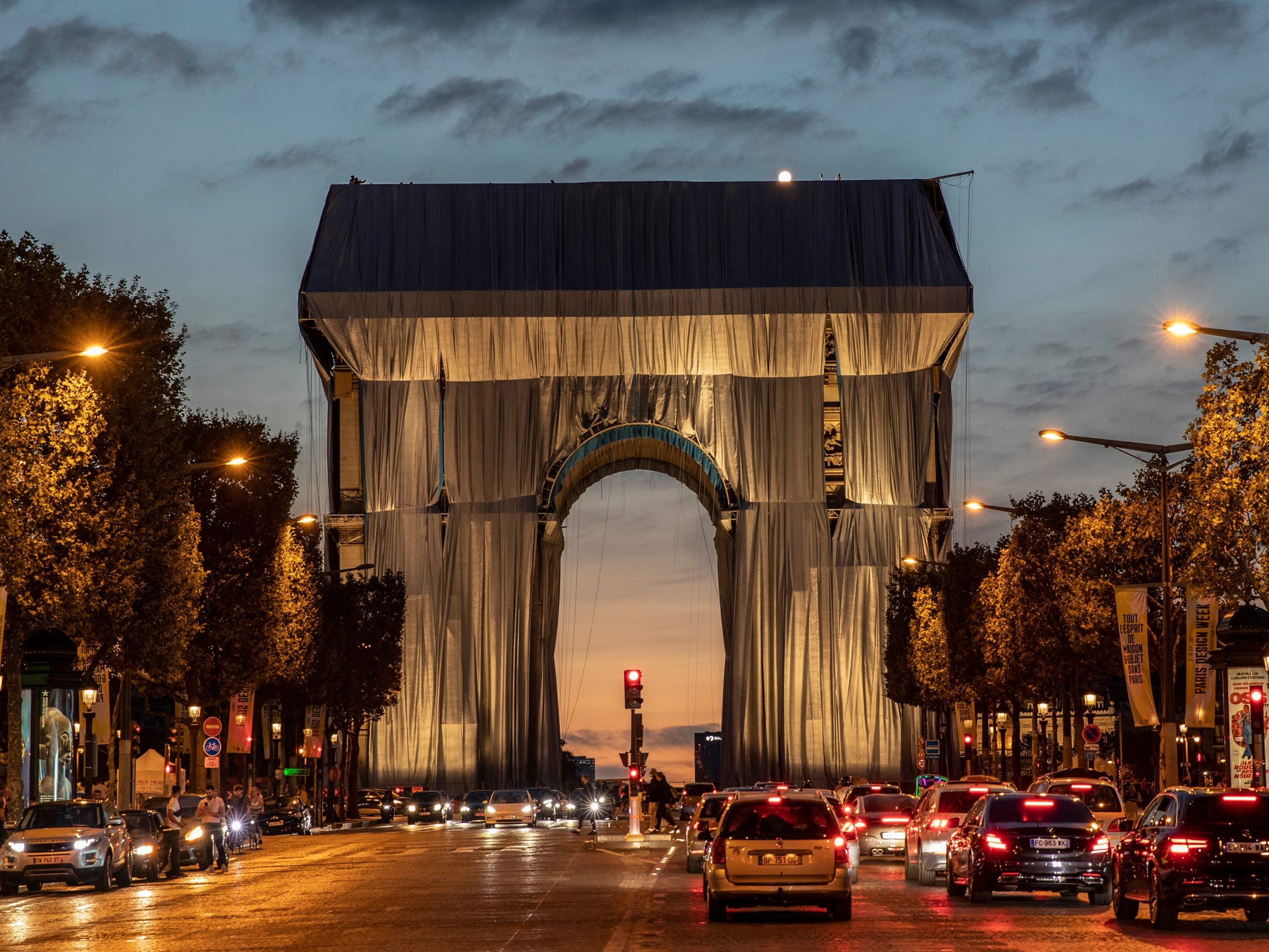 Workers begin the process of wrapping up the Arc De Triomphe monument in silver-blue fabric on September 12, 2021, in Paris, France.