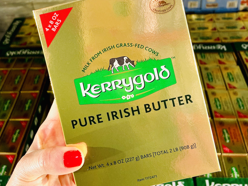 hand holding gold package of kerrygold irish butter