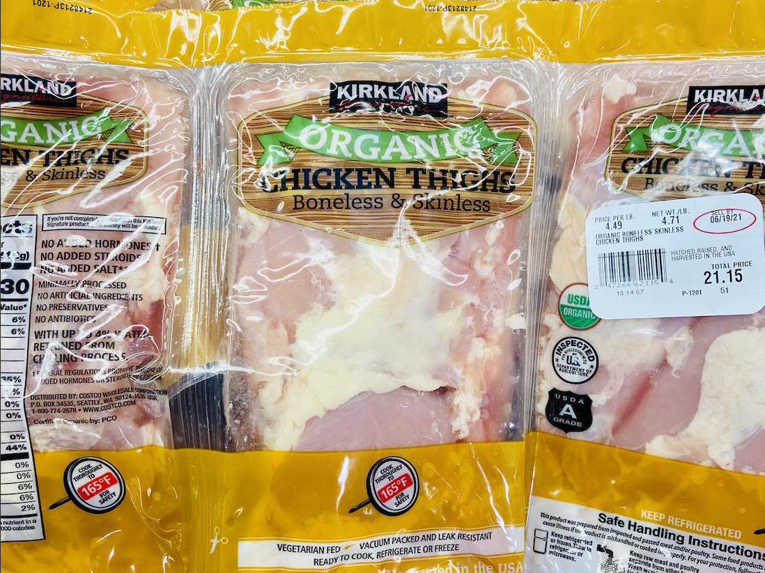 Yellow and clear packs of organic chicken thighs at costco