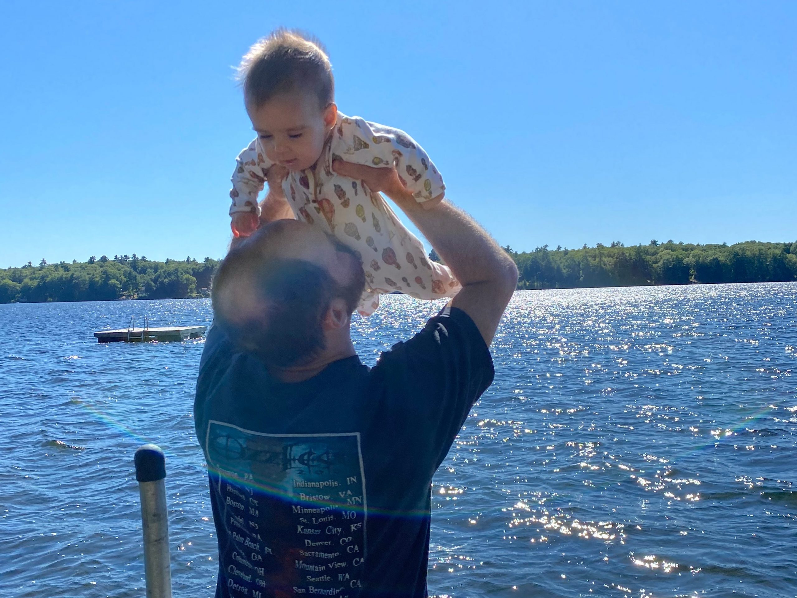 Conz Preti's husband playing with one of their daughters.