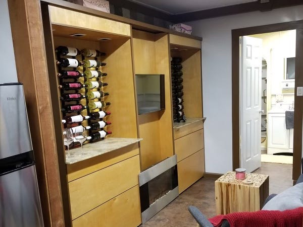 Wine racks border a TV in the living room of an Atlas bunker. Ron Hubbard/Atlas Survival Shelters