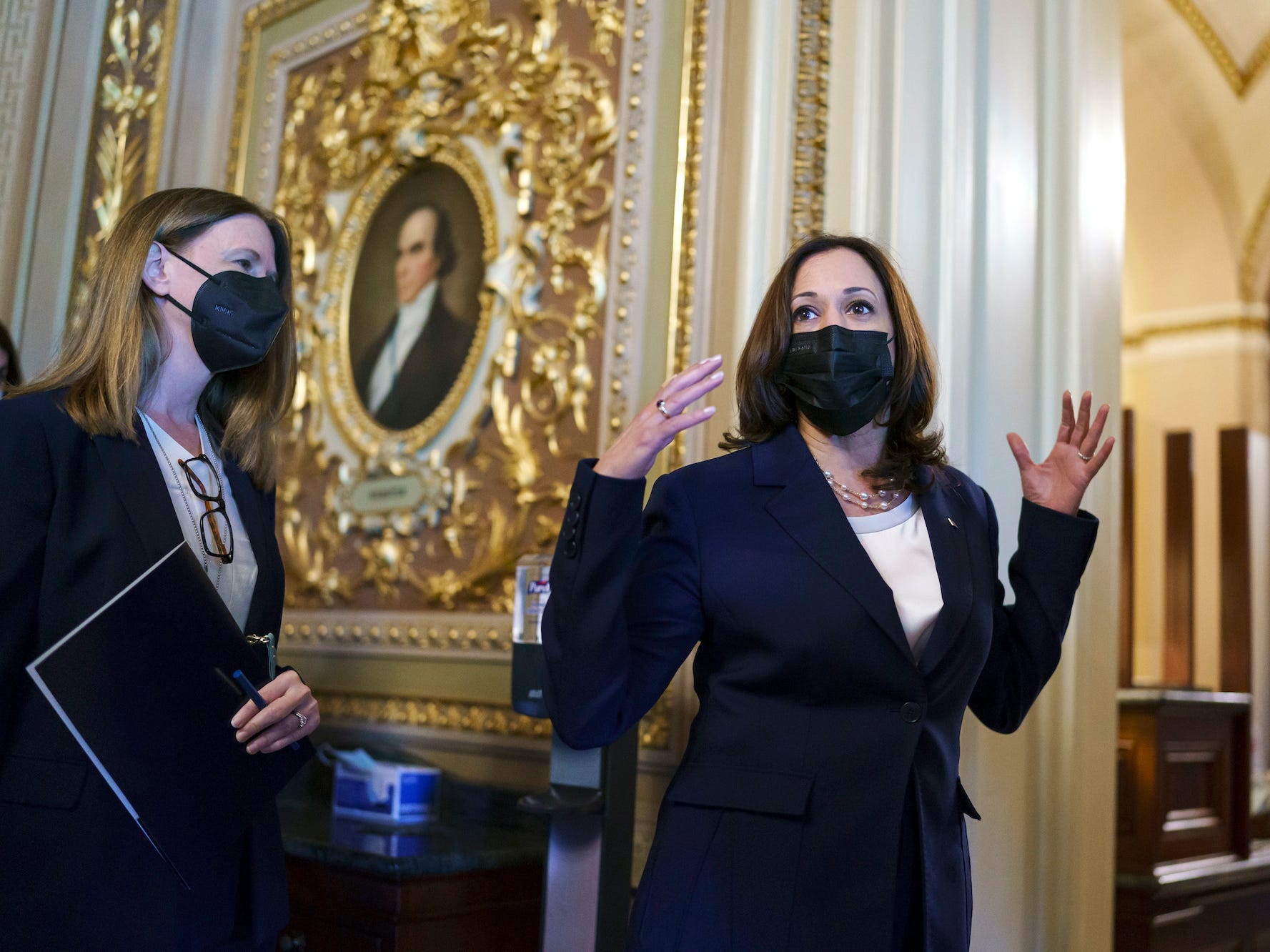 Vice President Kamala Harris arrives at the Senate as a coalition of Democrats and Republicans approve the $1 trillion bipartisan infrastructure package to deliver a cornerstone of President Joe Biden's agenda, at the Capitol in Washington, Tuesday, Aug. 10, 2021.