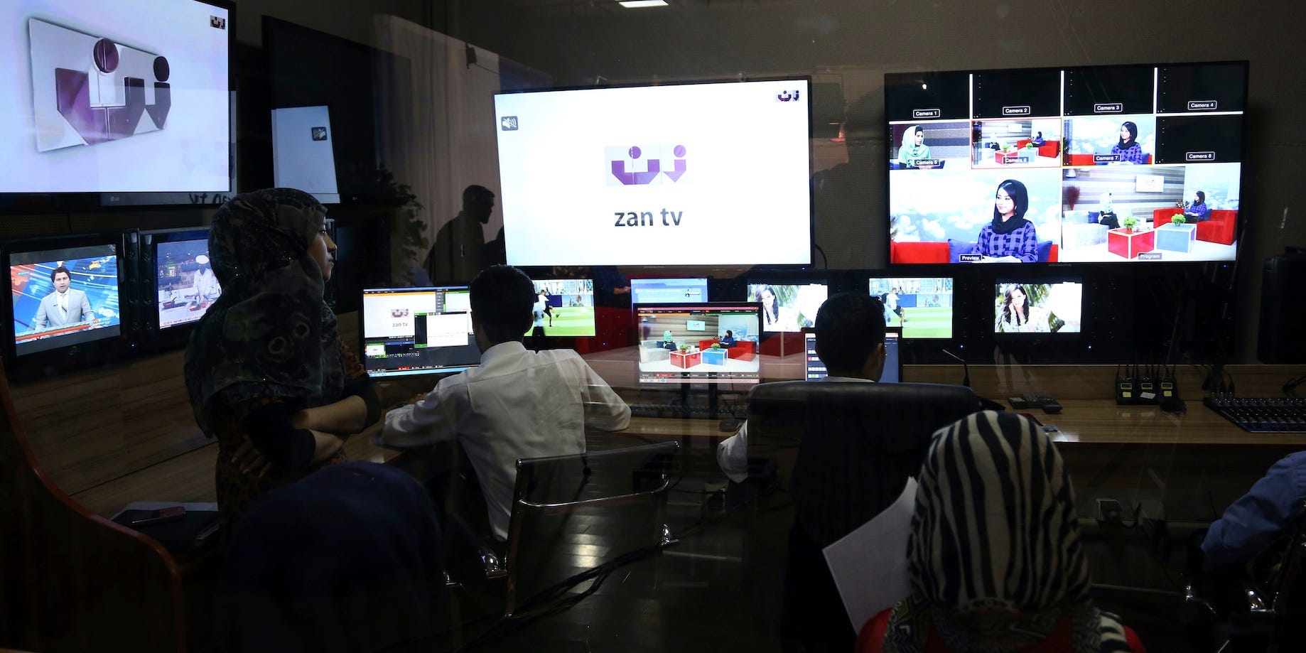 ZAN TV staff work on screens