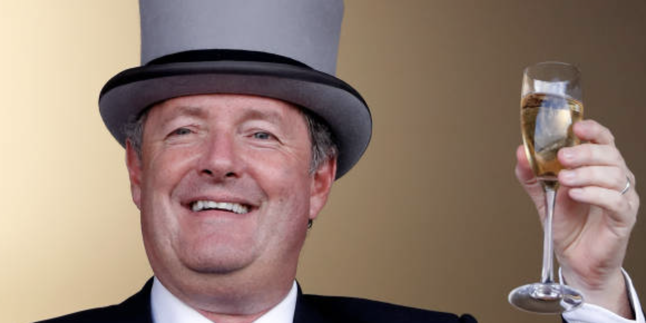 Piers Morgan toasts a glass of champagne wearing a grey tophat on day 2 of Royal Ascot at Ascot Racecourse on June 20, 2018 in Ascot, England.