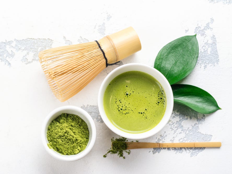 Stirred matcha with powder and whisk.