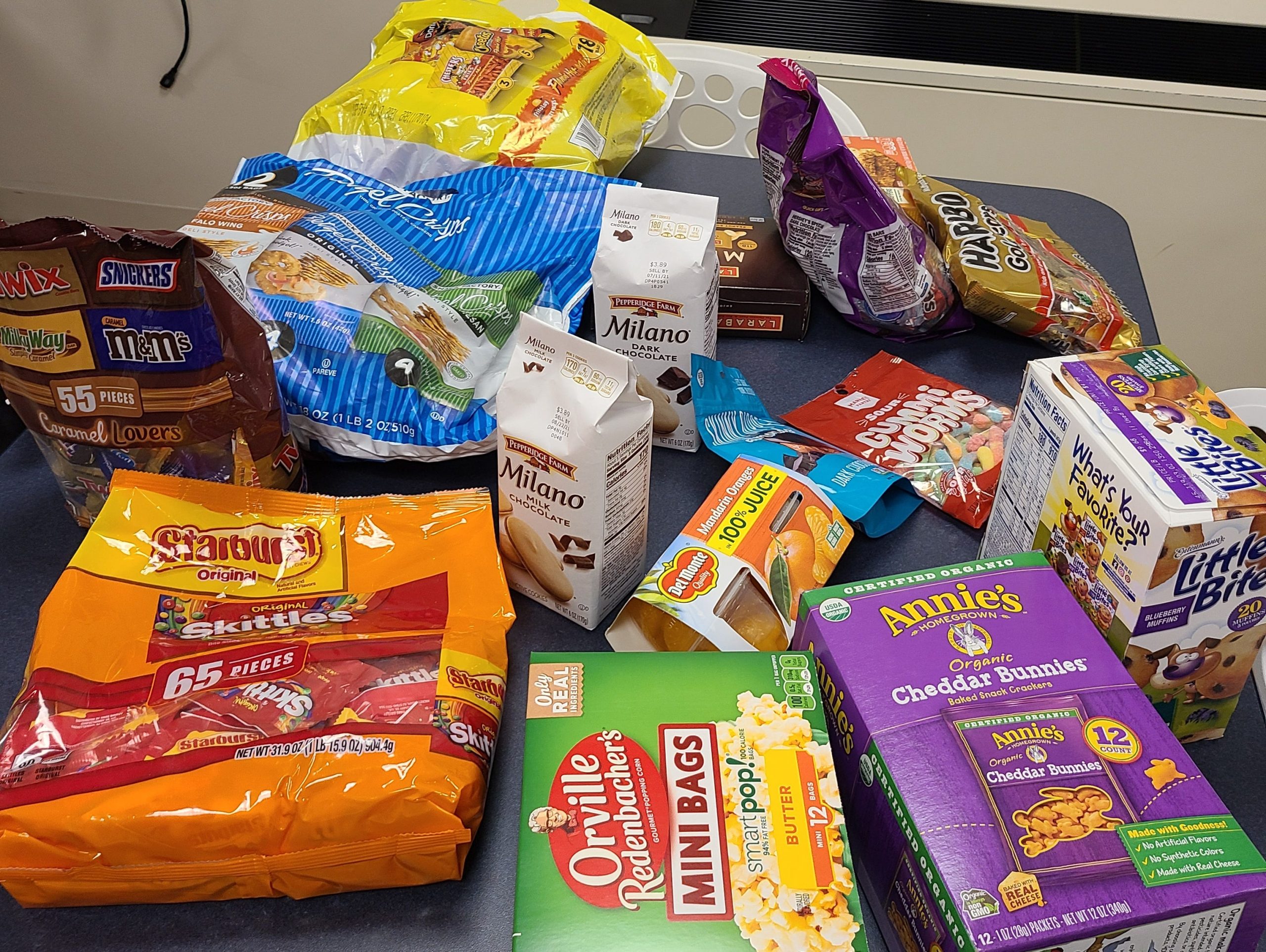 bags and boxes of snacks on a table