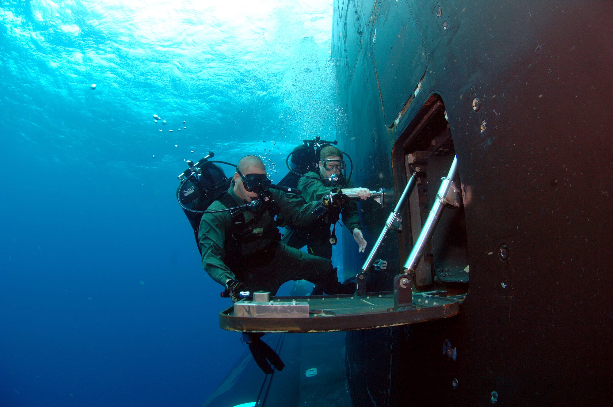 Naval Special Warfare and Navy SEAL diver on submarine