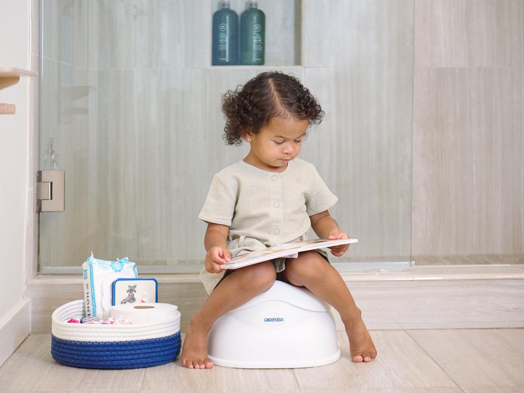 Toddler sitting in a small potty