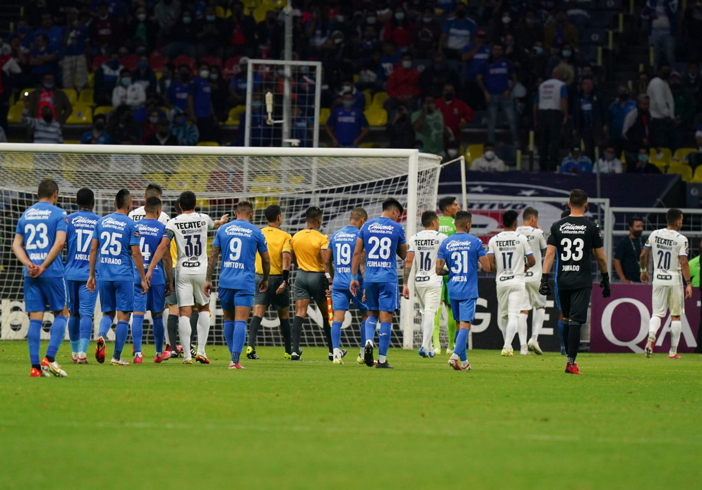 Players of Mexico's Cruz Azul and Monterrey leave the pitch after referee suspended the game for ten minutes because of homophobic chants from fans.