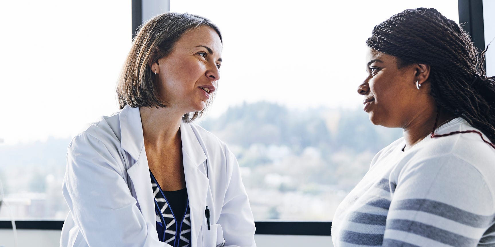 black woman talking to her doctor or OBGYN