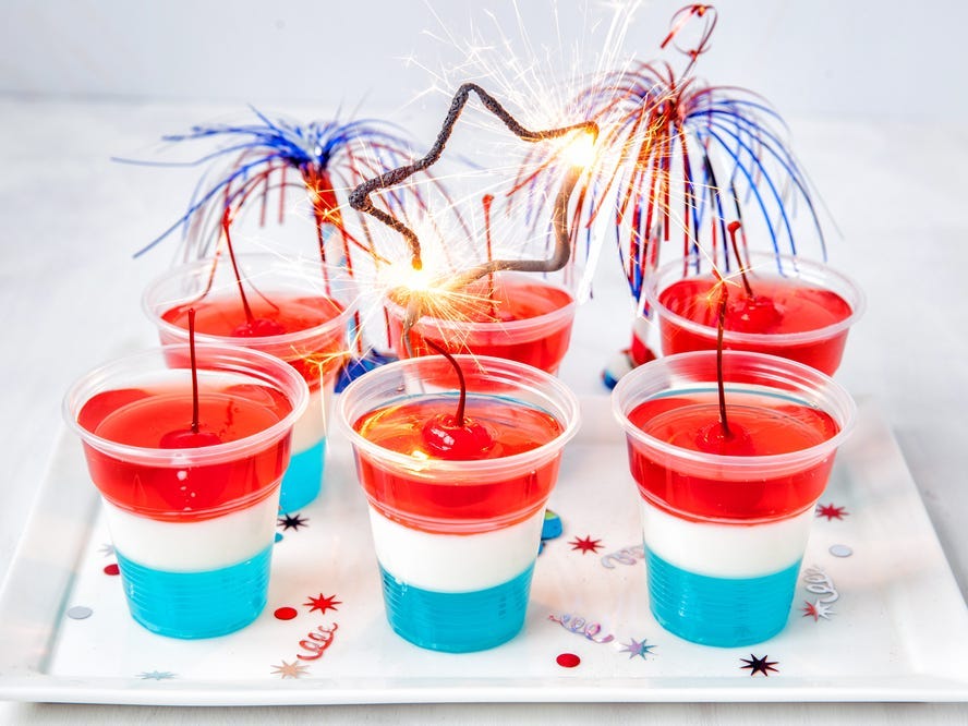 Six red, white, and blue jello shots.