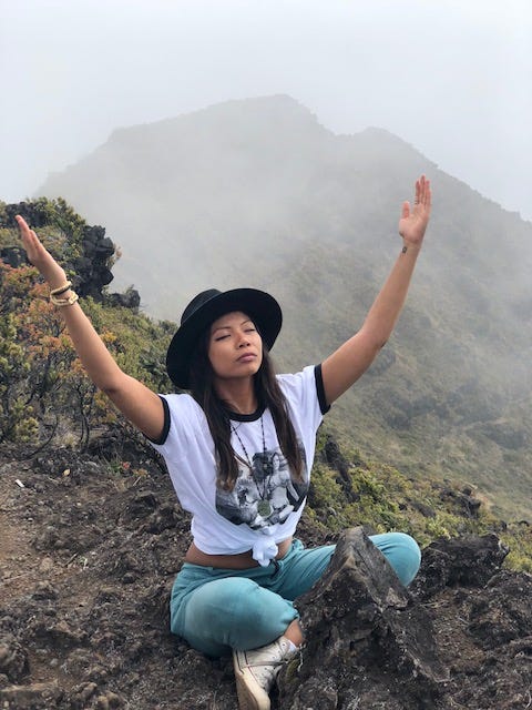 Actress Jessica Joan meditates atop a mountain. Joan has published, “The Untouchable Jessica Joan : A Real Life Journey Of Love, Forgiveness And Evolution From The Jane Doe Who Helped Bring The NXIVM Cult To Justice,” about her life in the NXIVM sex cult