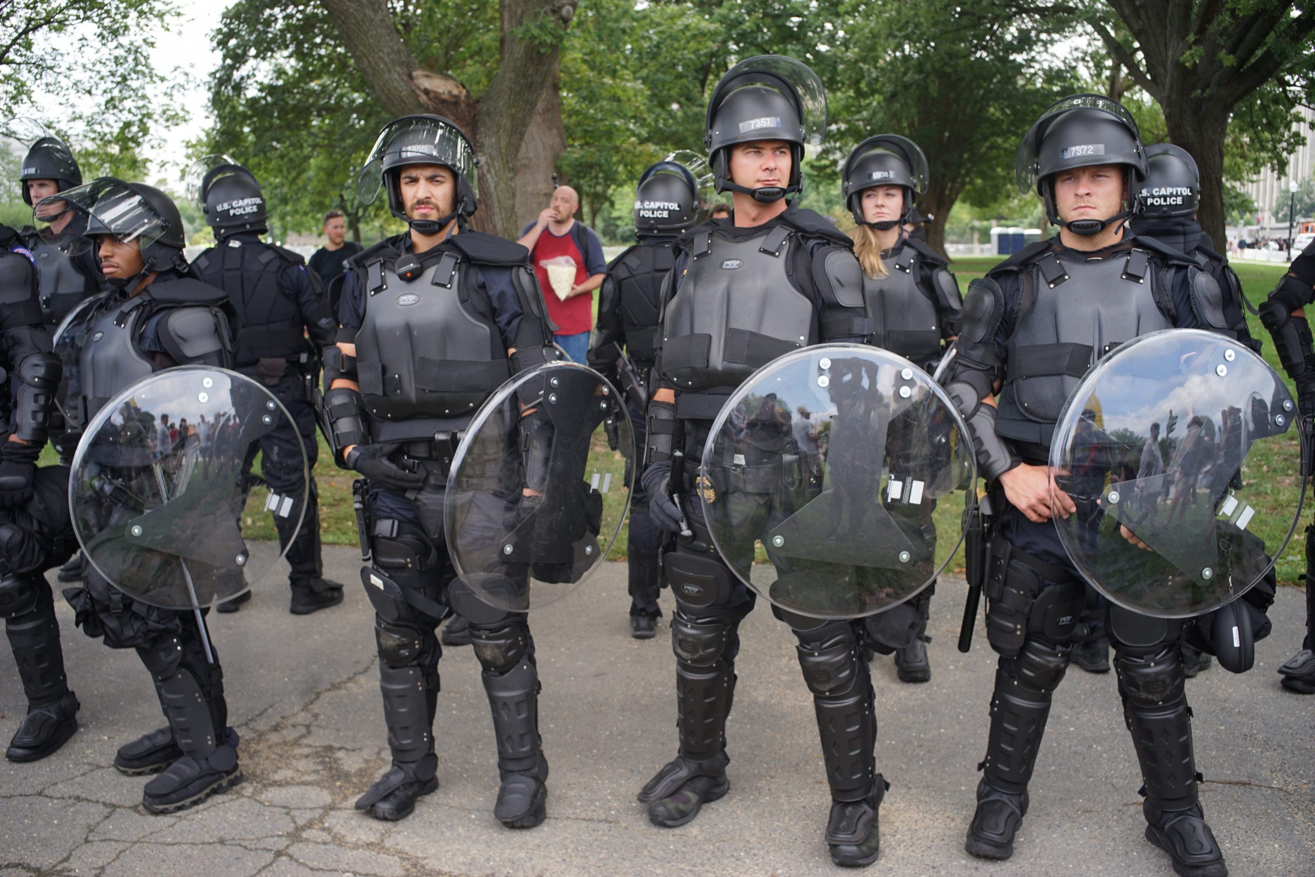 A row of police in riot gear.