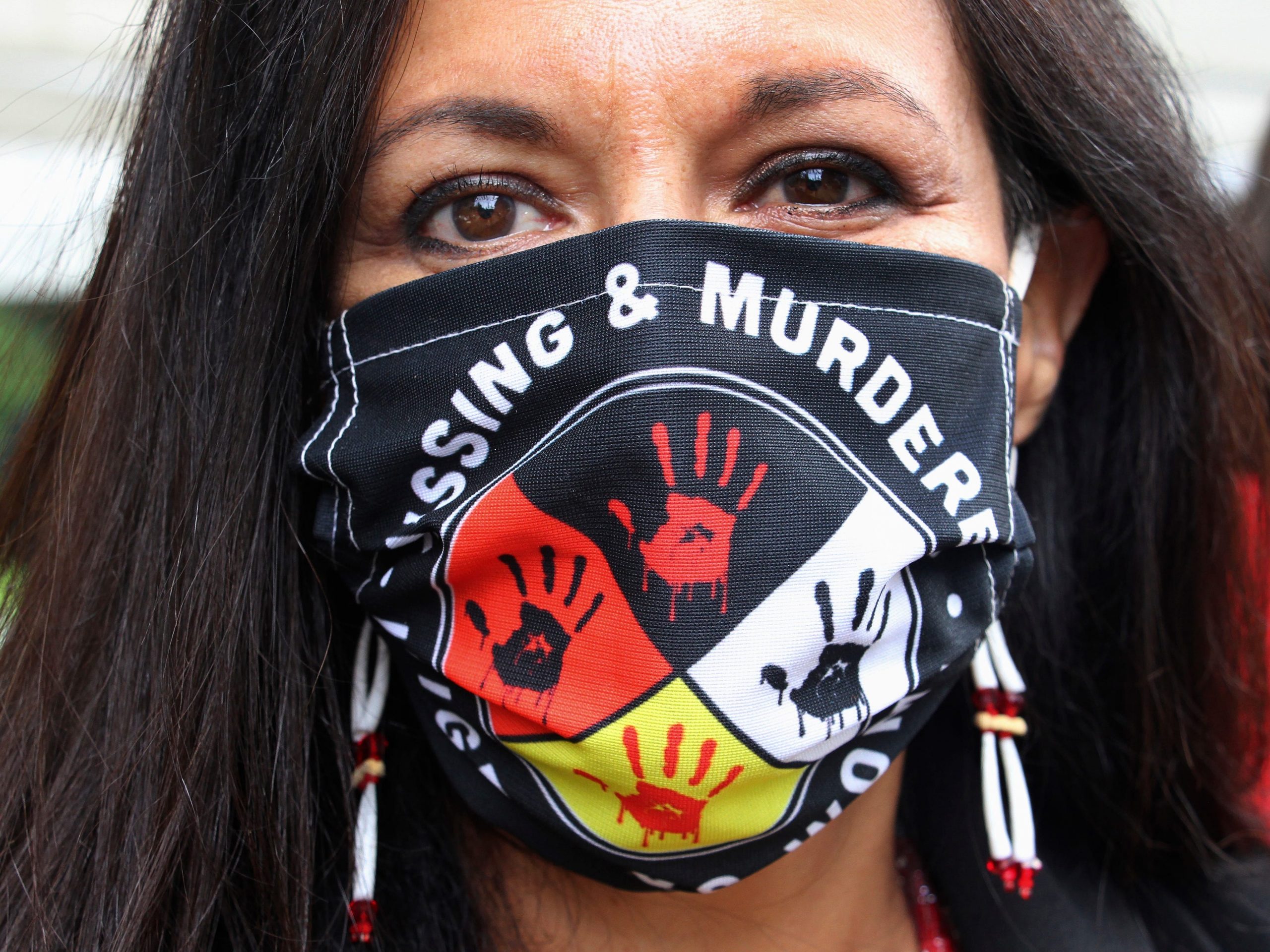 Jeannie Hovland, the deputy assistant secretary for Native American Affairs for the U.S. Department of Health and Human Services, poses with a Missing and Murdered Indigenous Women mask on Aug. 26, 2020.