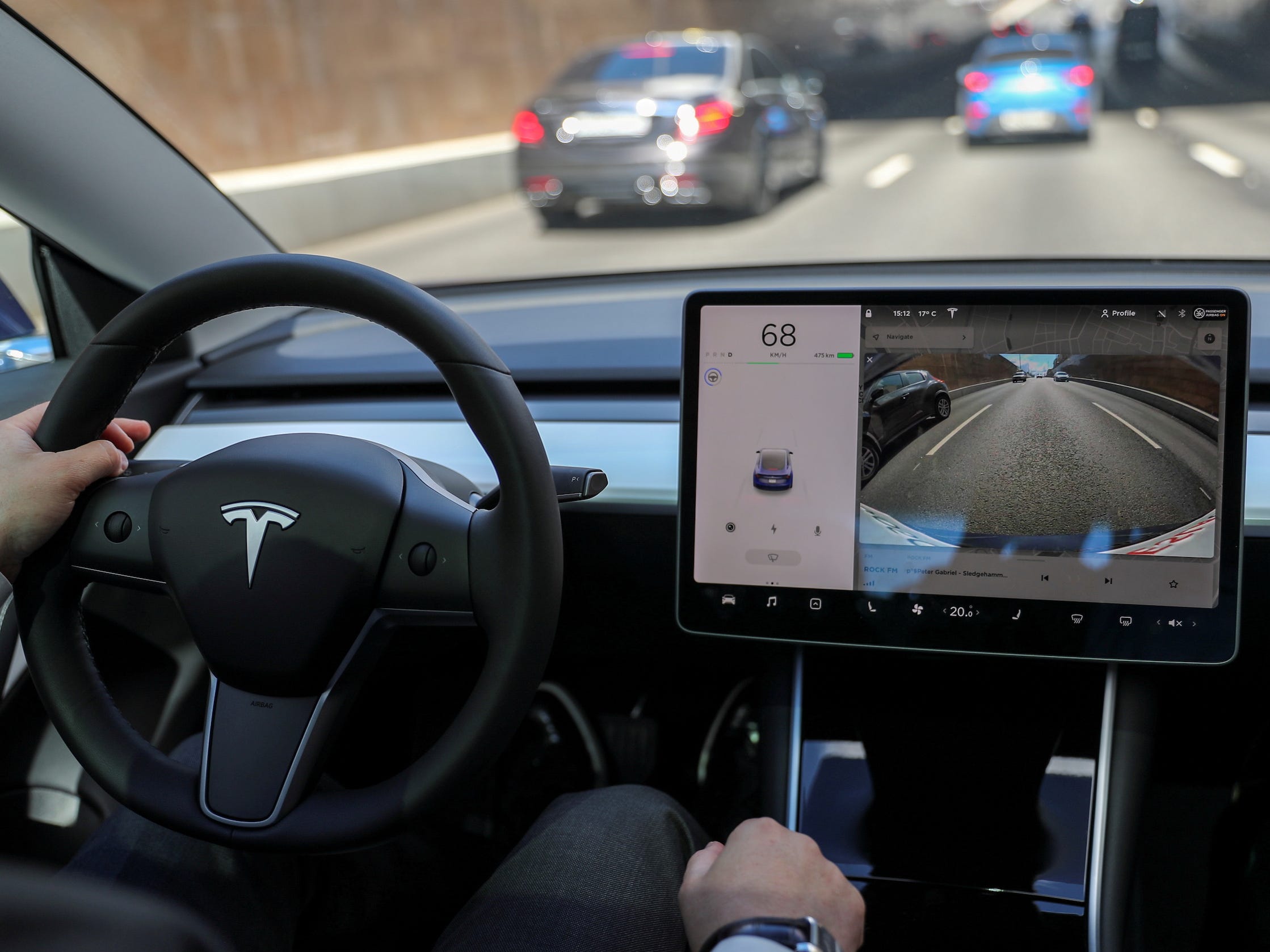 The interior of a Tesla driving down the highway