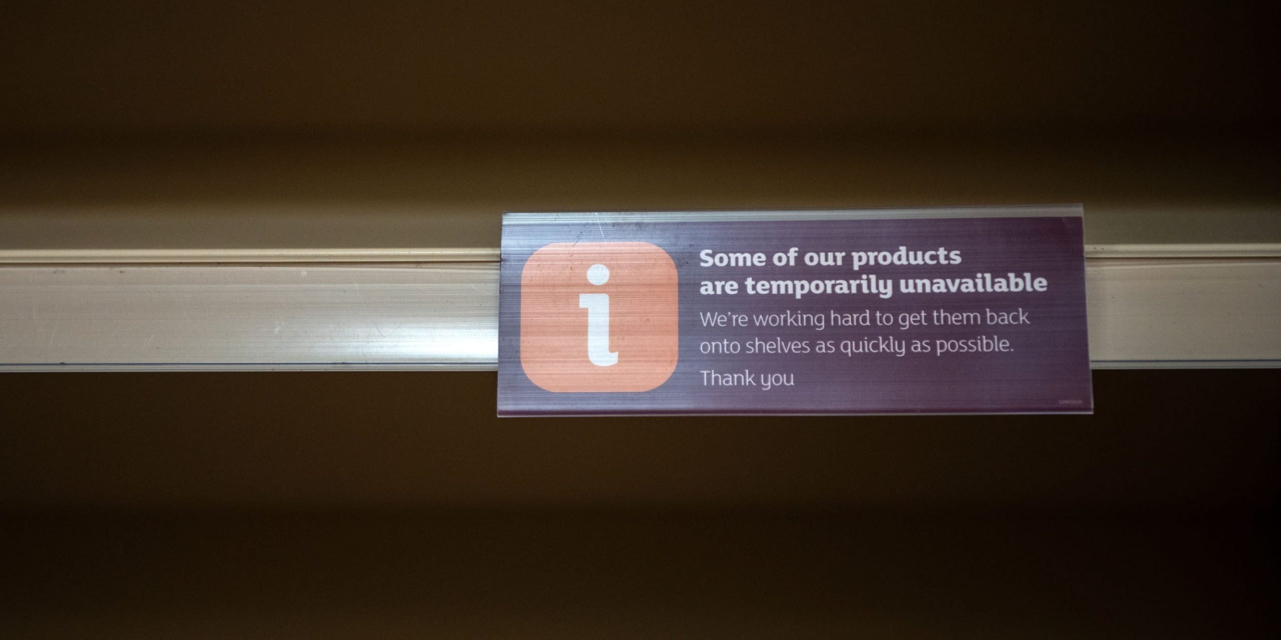 sign on empty shelves inform customers of a lack of products at a Sainsburys supermarket on September 19, 2021 in London, England. Gaps in supermarket shelves have appeared more frequently as a shortage of lorry drivers disrupted supply chains. Now, rising energy prices have disrupted the production of C02, a gas critical to the production and transport of meat, bread, beer and more.