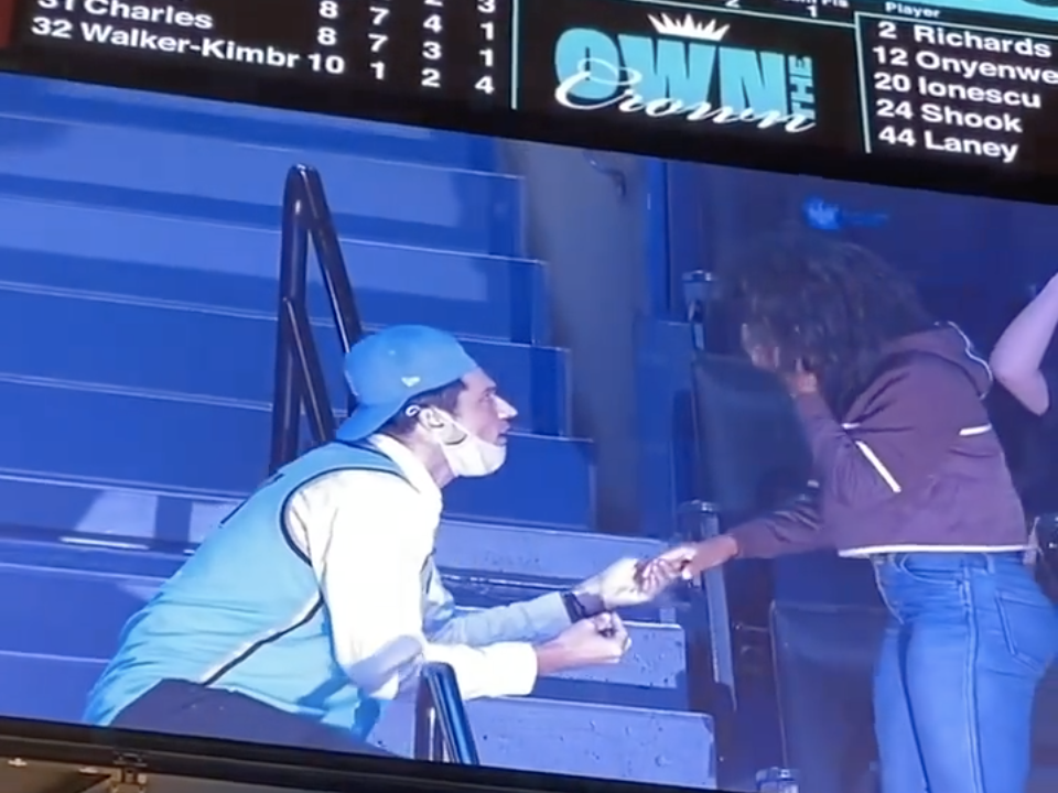 A fan at the Barclays Center proposes while displayed on the Jumbotron.
