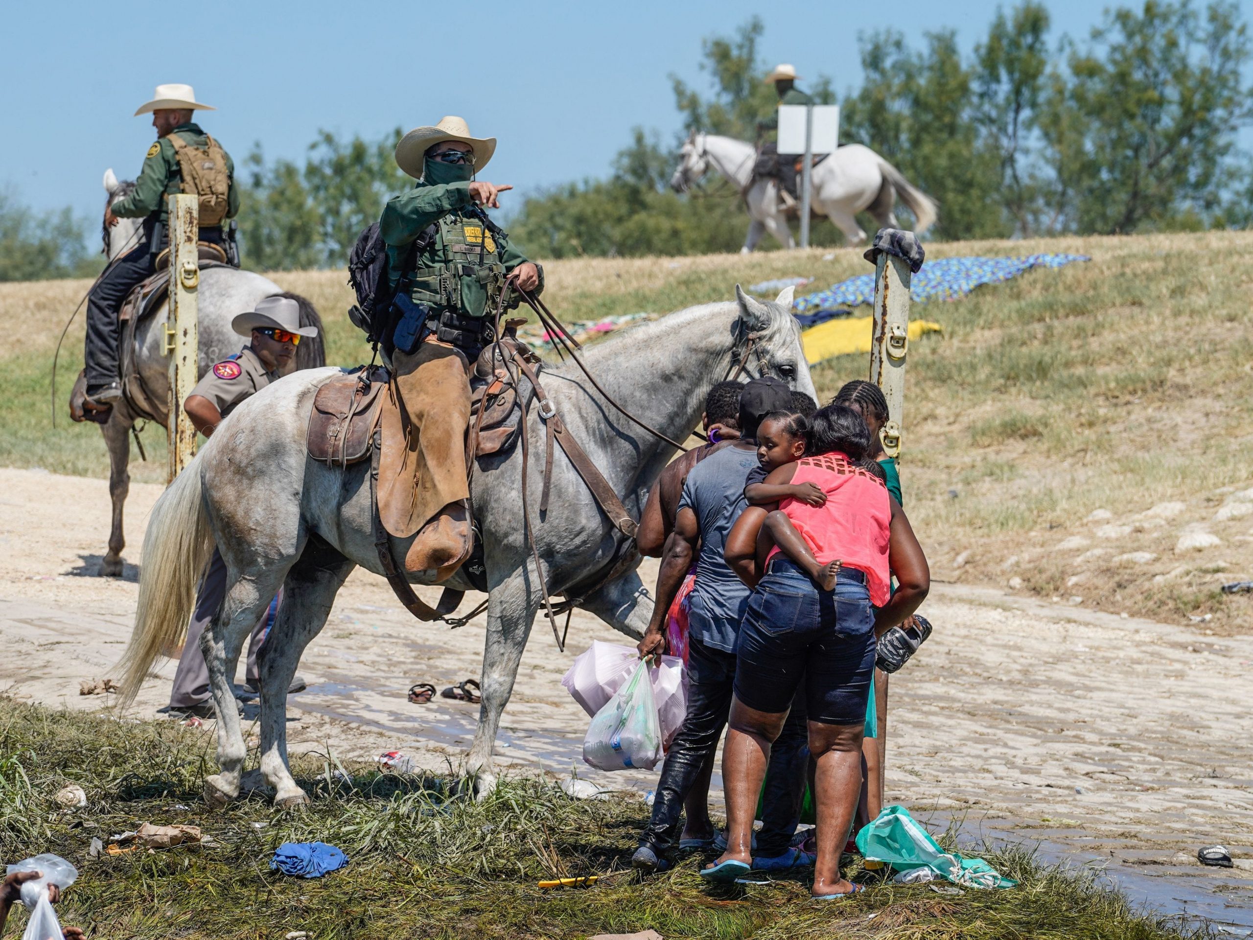 A United States Border Patrol agent on horseback tries to stop Haitian migrants from entering an encampment on the banks of the Rio Grande near the Acuna Del Rio International Bridge in Del Rio, Texas on September 19, 2021.