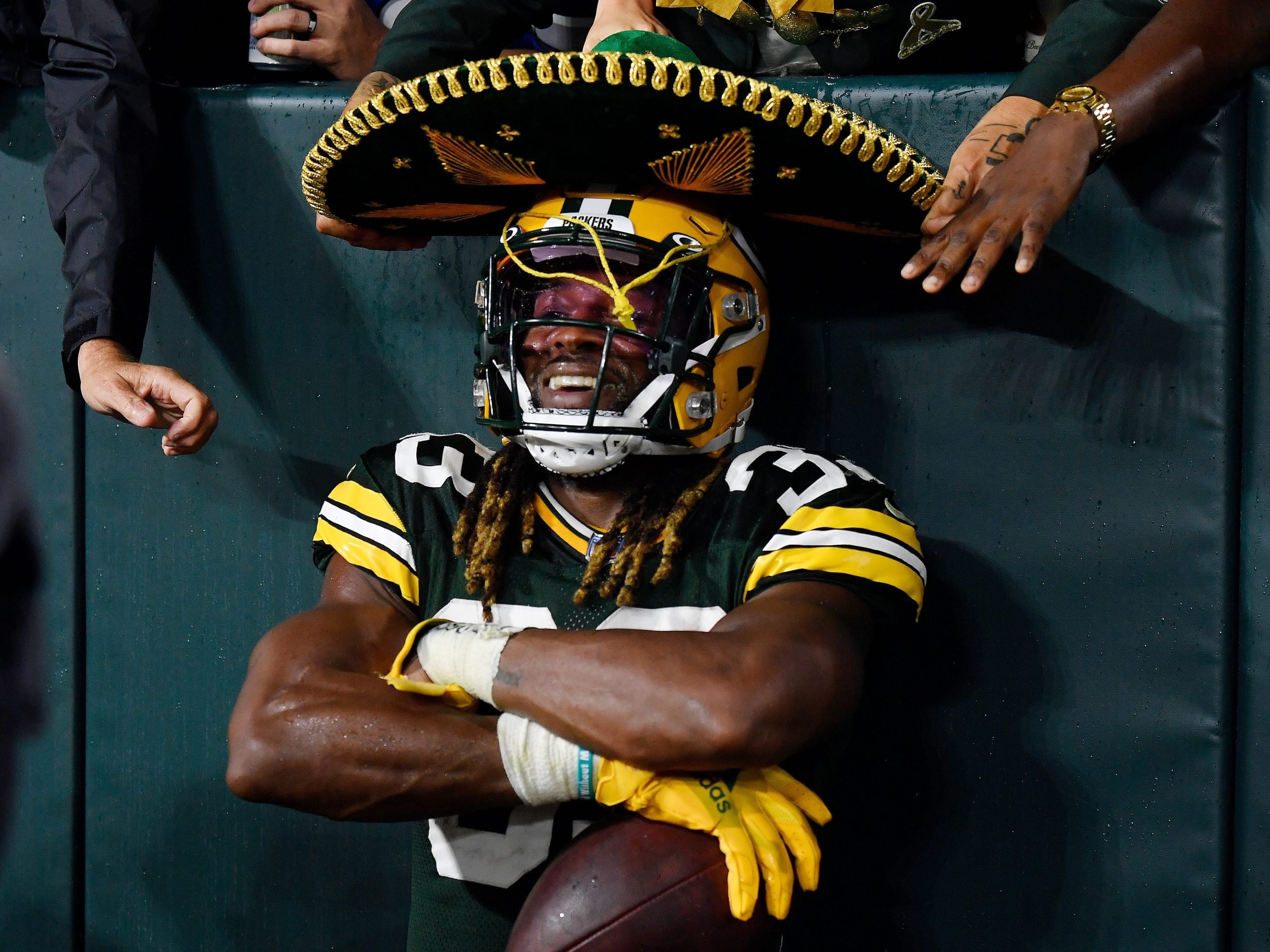 Green Bay's Aaron Jones wears a sombrero after scoring a touchdown against the Detroit Lions