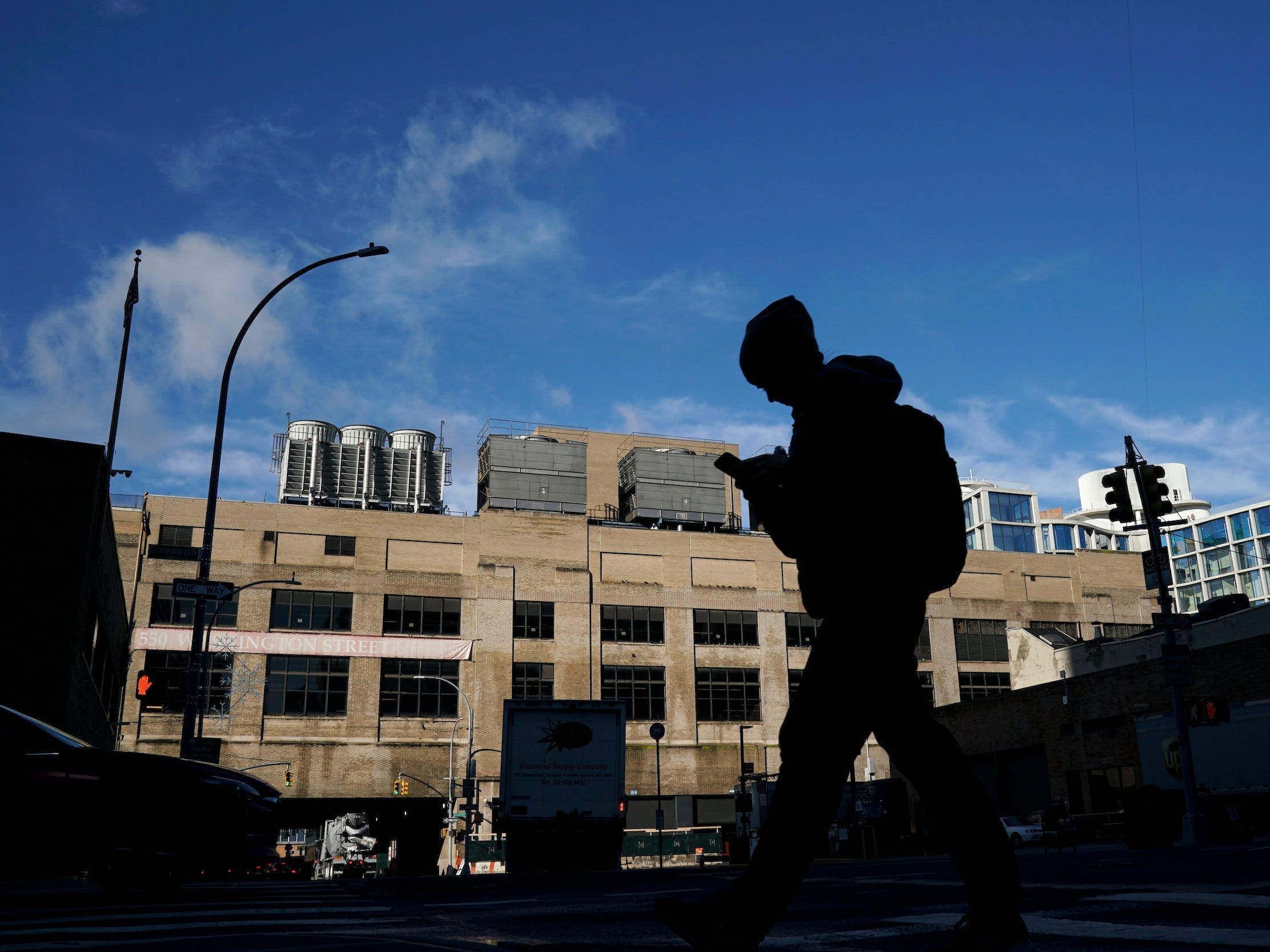 A person walks by an old terminal building in New York City