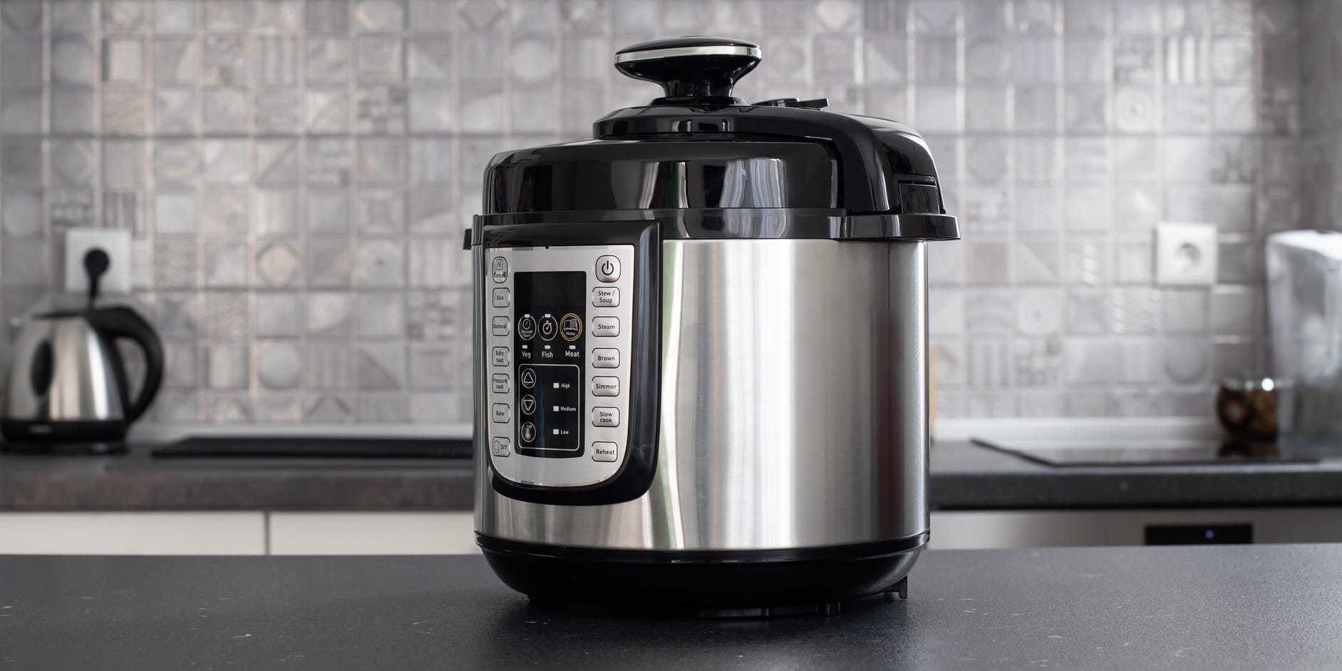 A multi cooker on a counter.