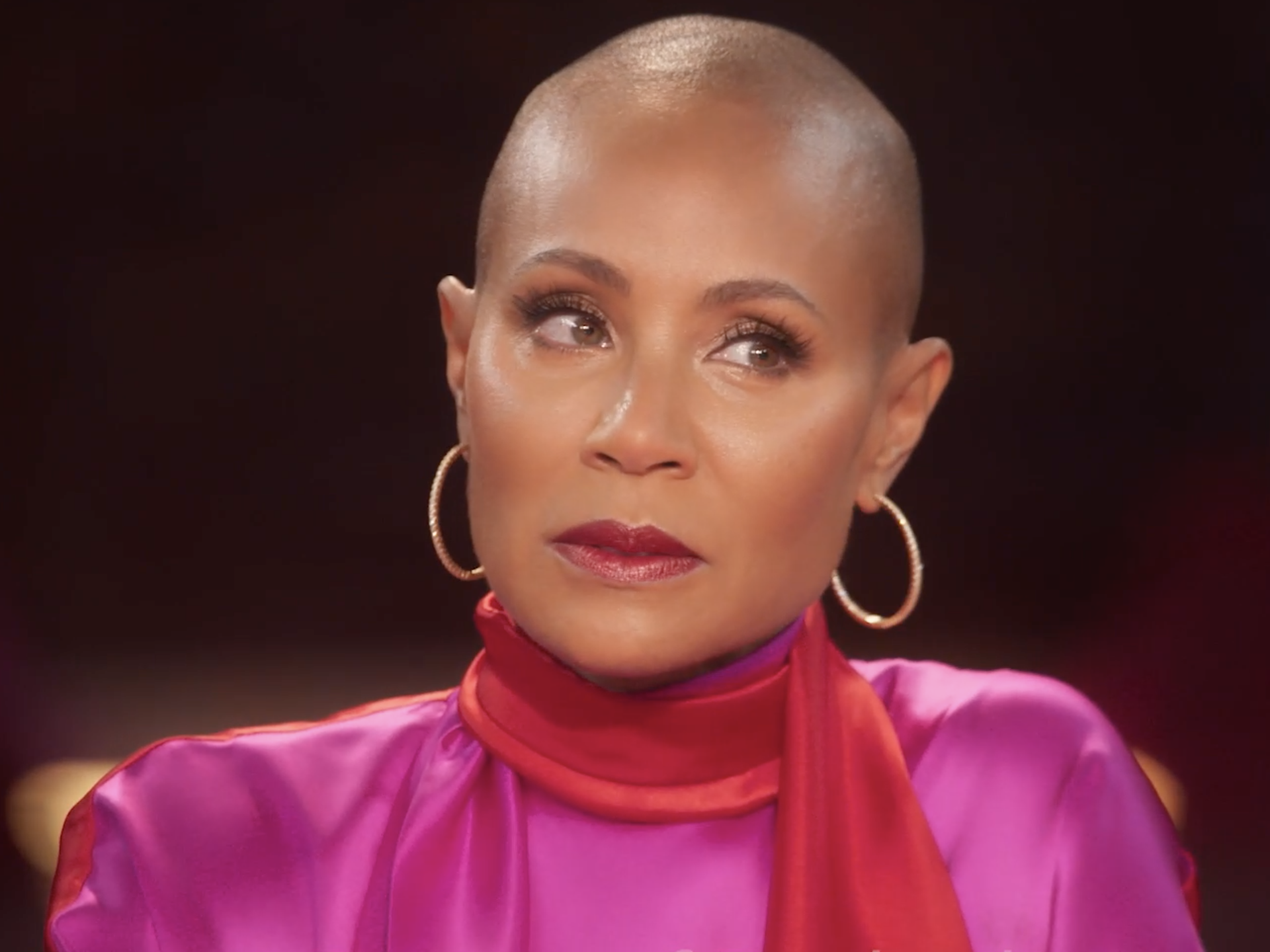 Jada Pinkett Smith wearing a bright pink outfit on "Red Table Talk."