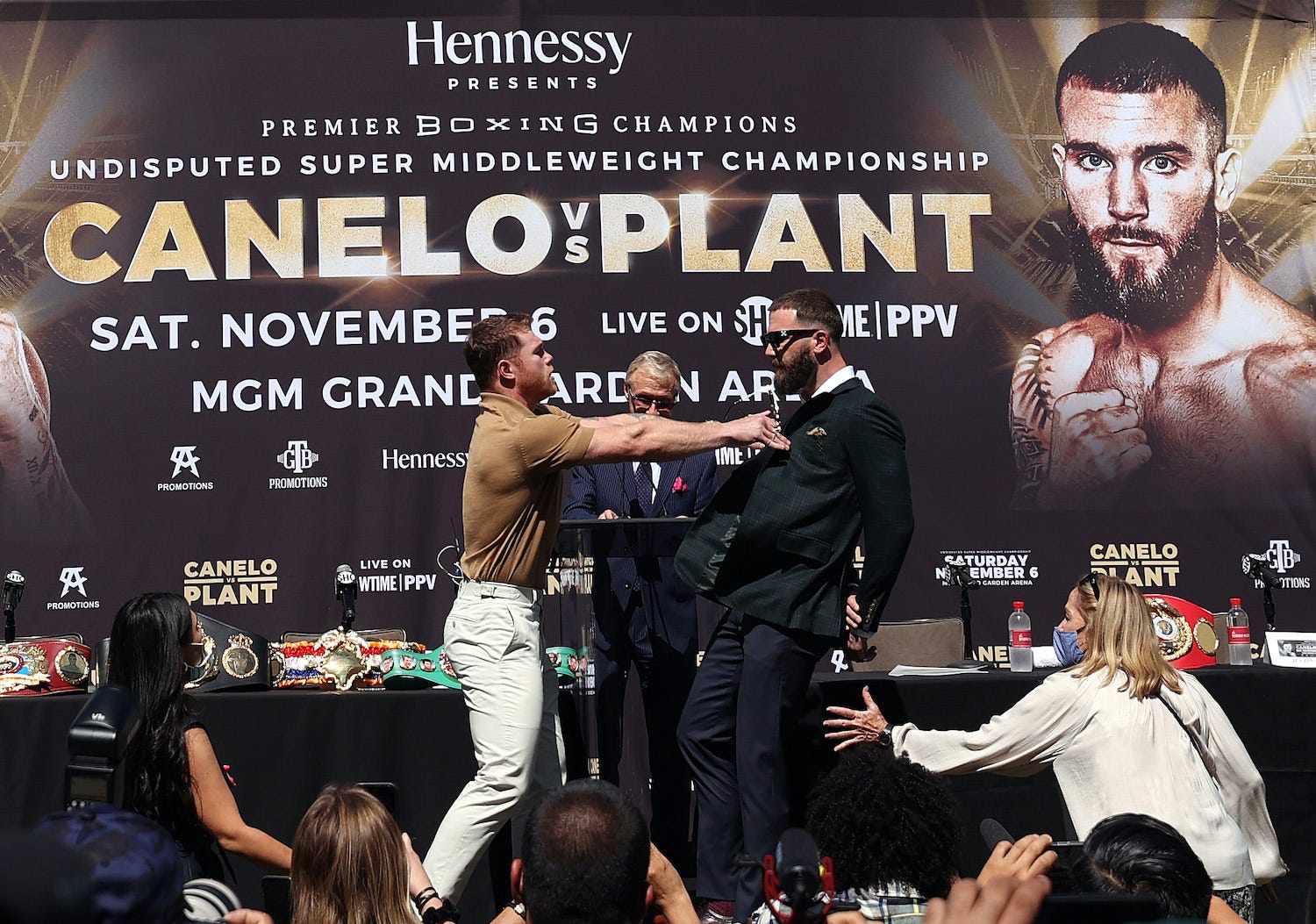 Saul 'Canelo' Alvarez shoves Caleb Plant at a boxing press conference September 21.