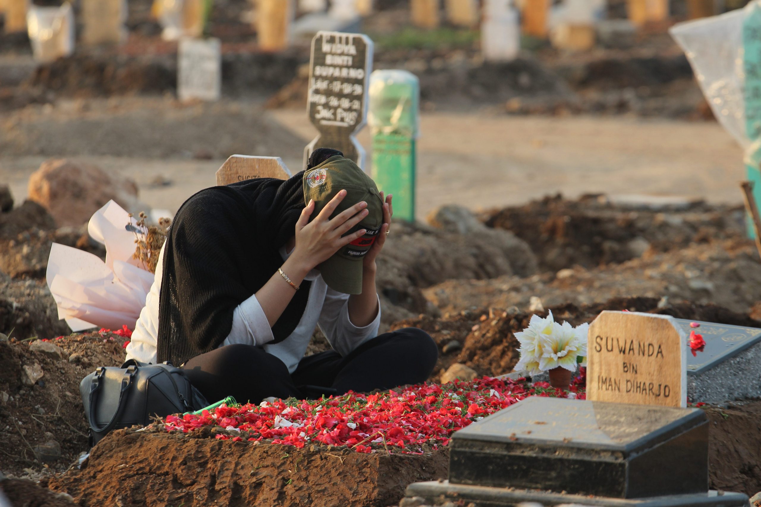 Jakarta resident mourning relative